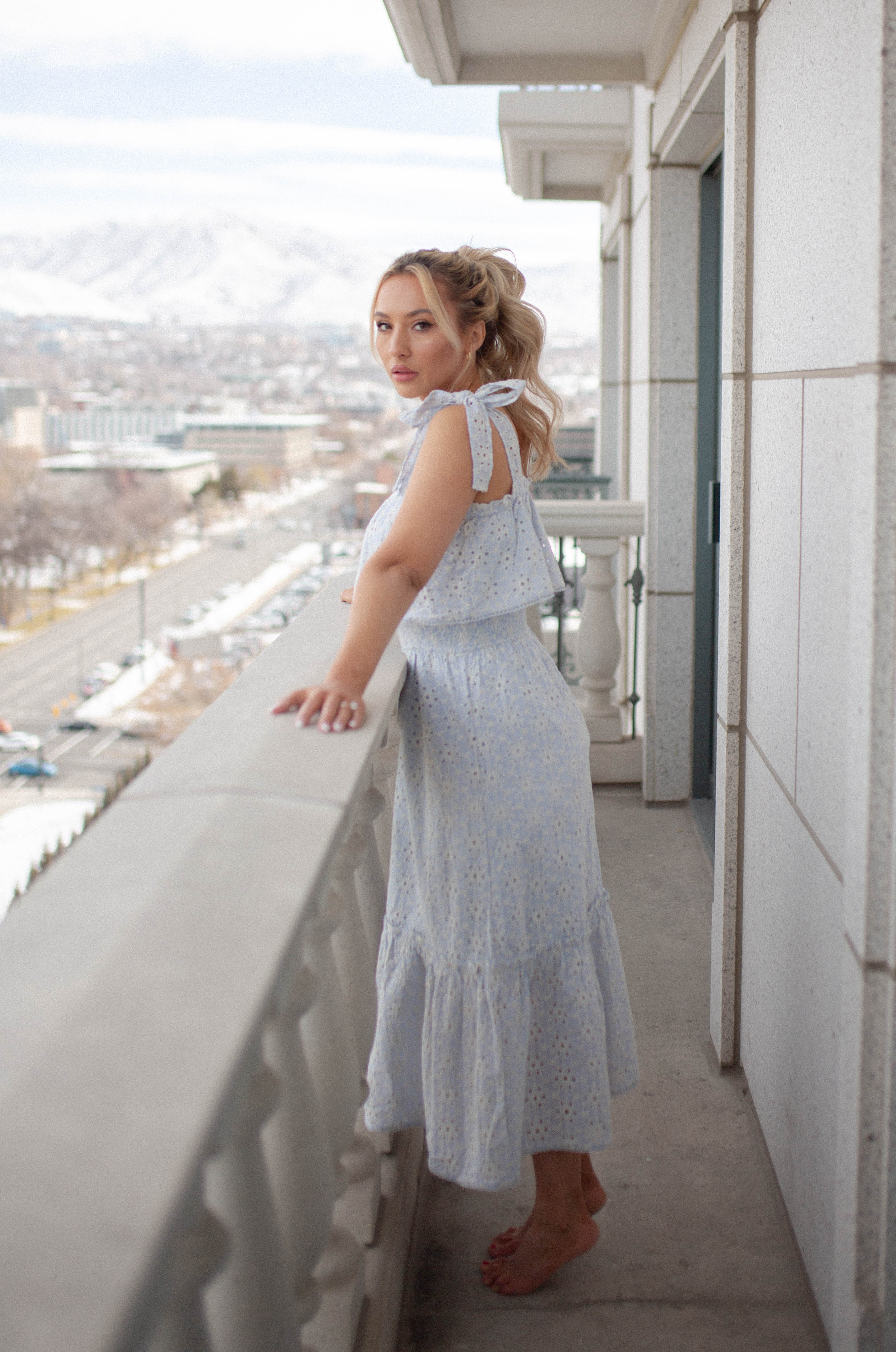 feminine midi dress with a ruffle hem and eyelet detailing