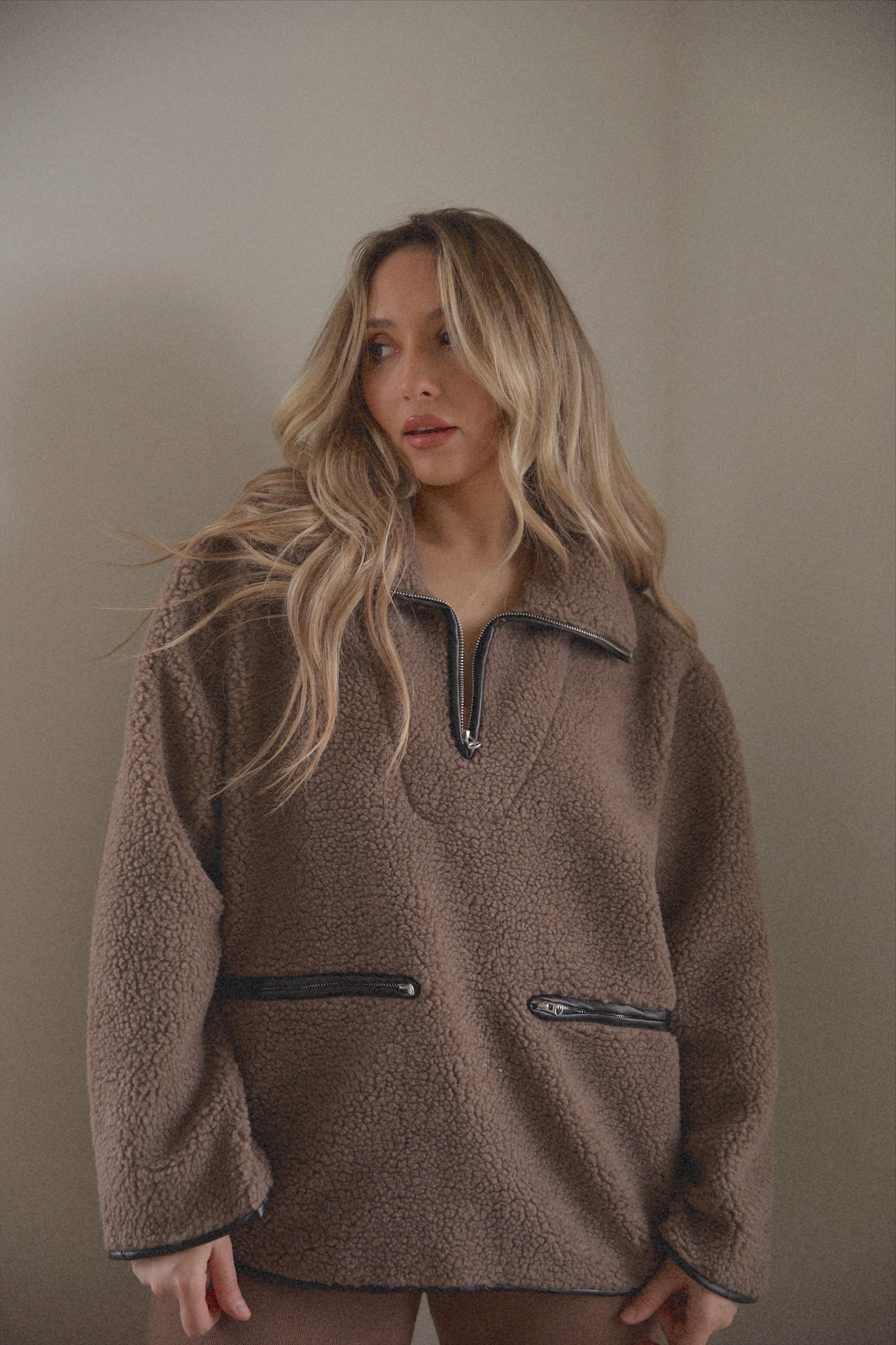 brown sherpa teddy sweater with black leather piping