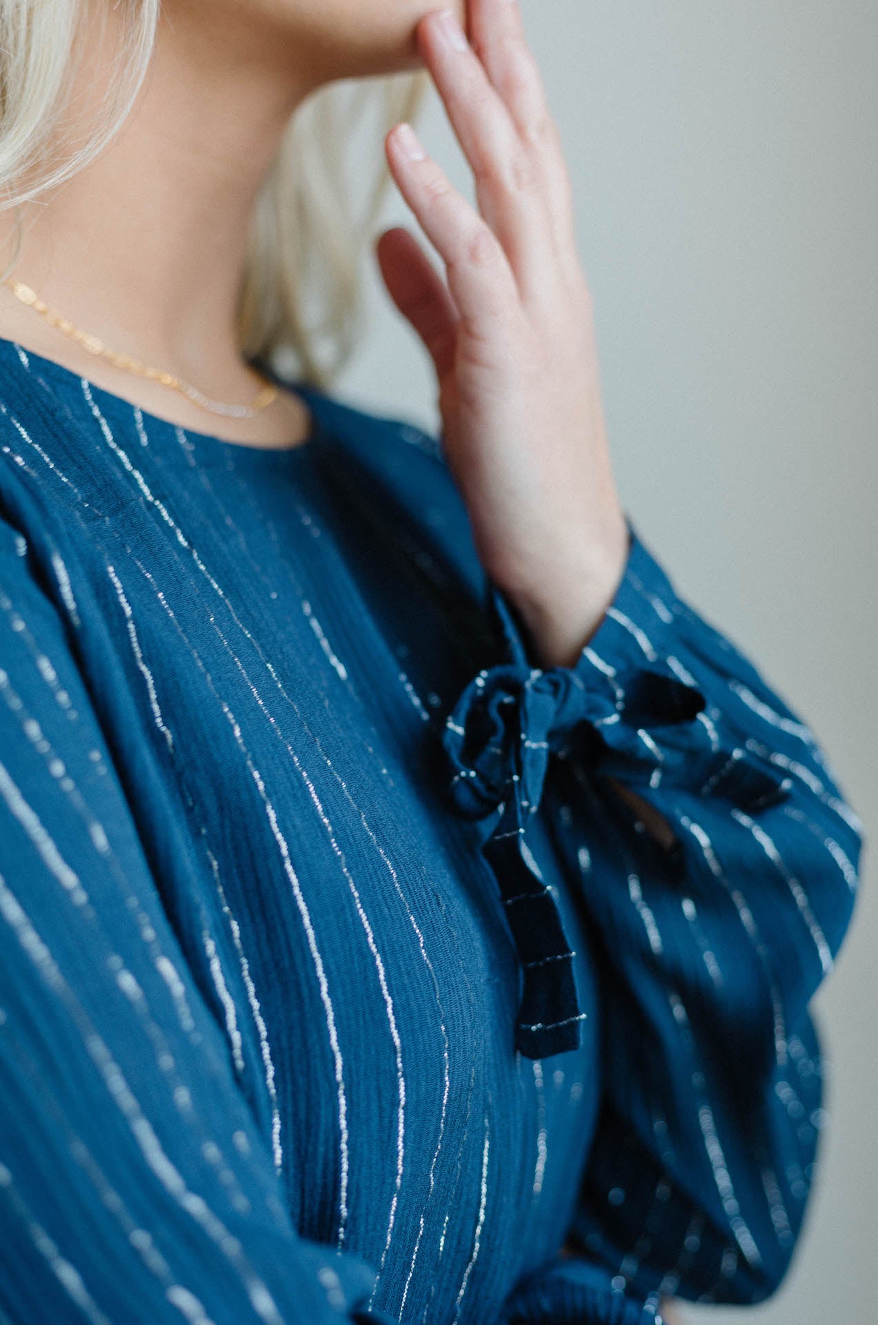blue mini dress with long sleeves and ruffle hem