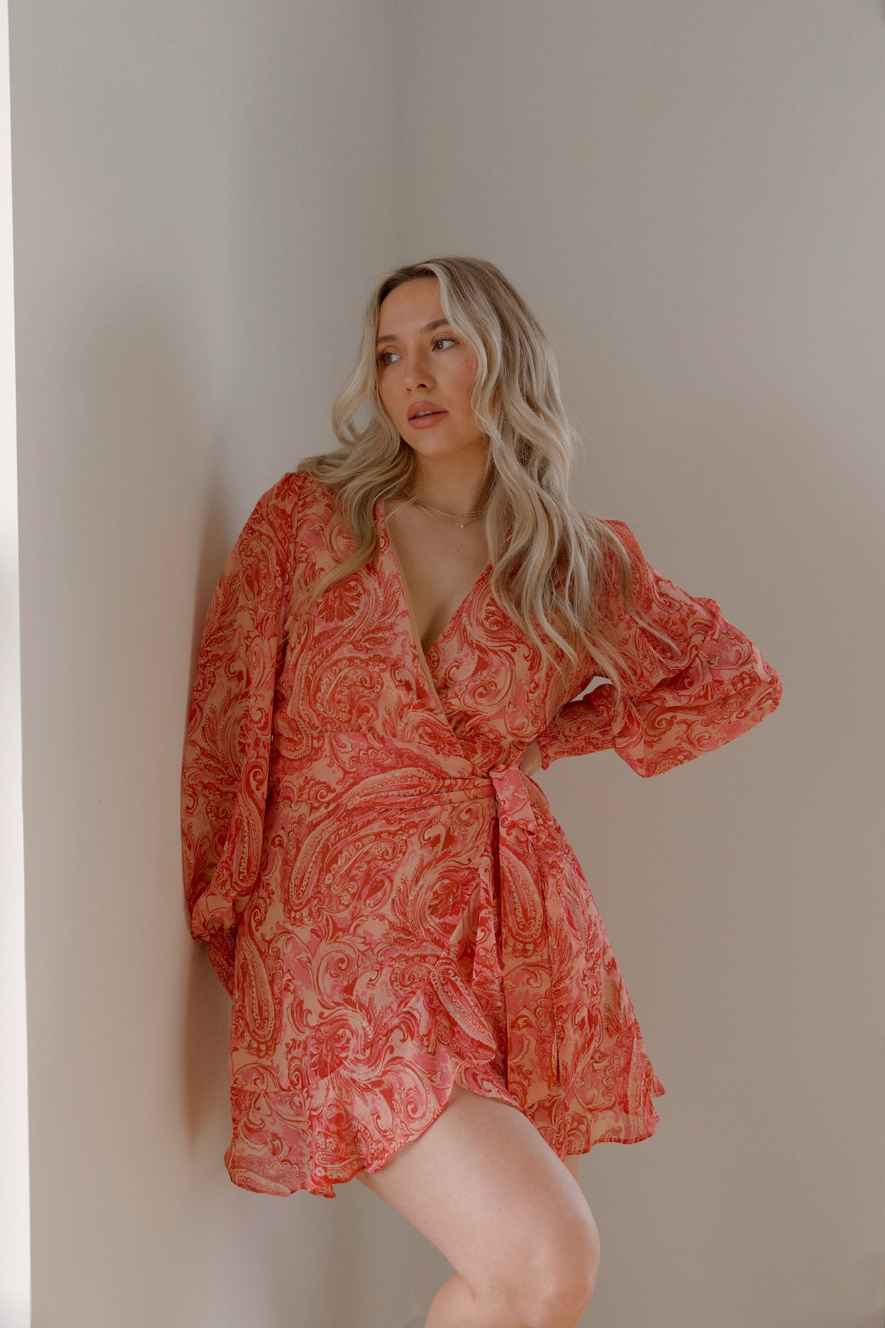 pink and orange paisley print mini wrap dress