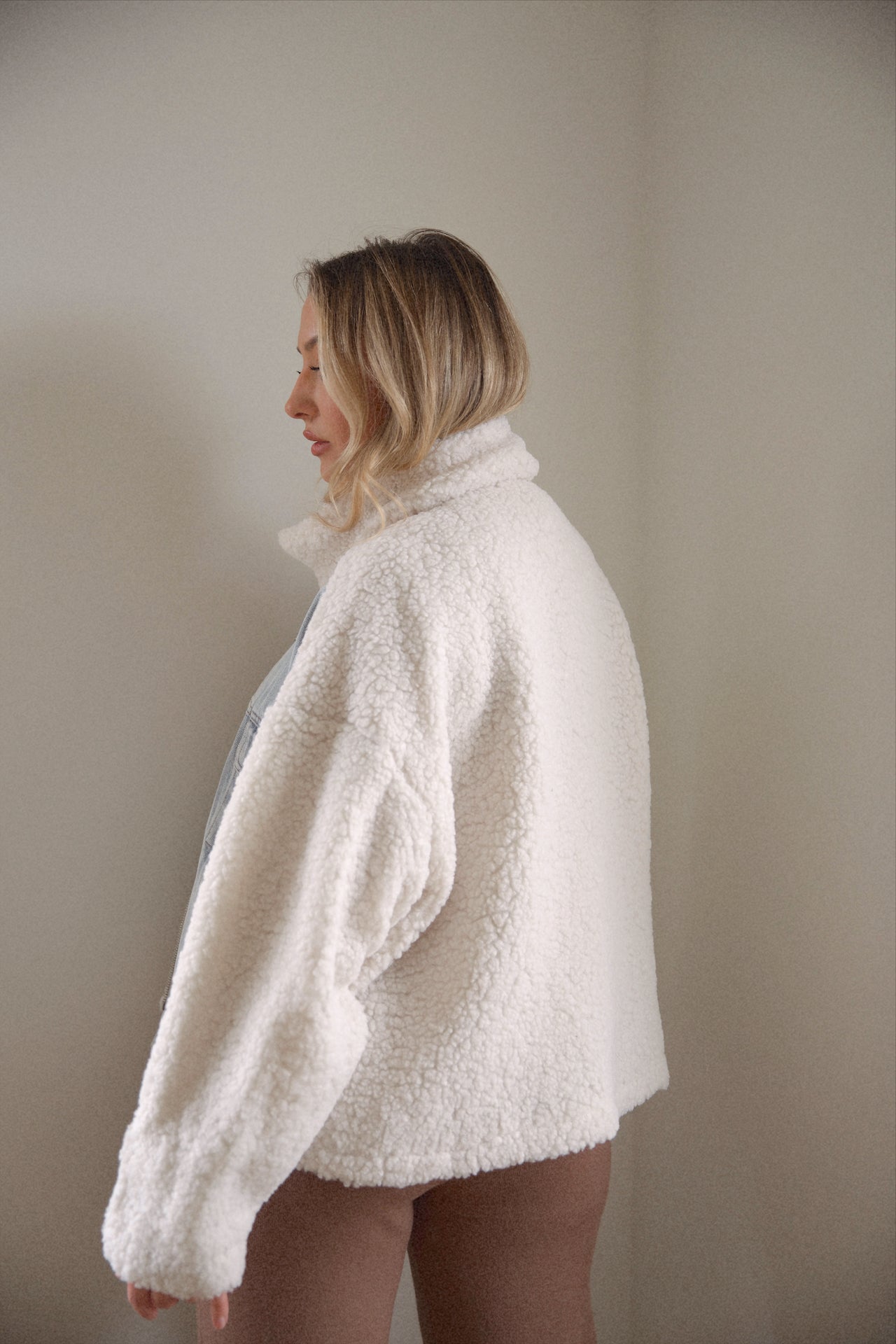 oversized denim jacket with sherpa lining and a zip up denim jacket closure
