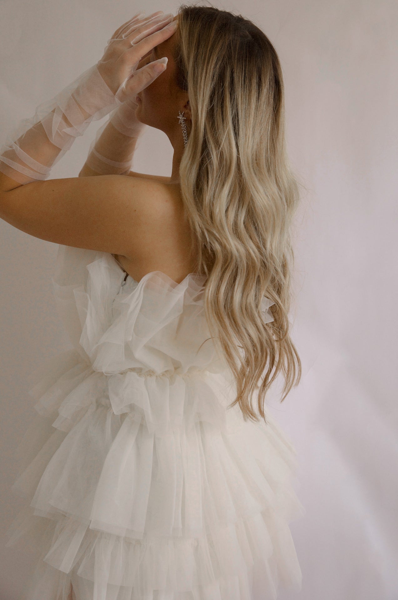 strapless tulle mini dress with a tiered cream organza