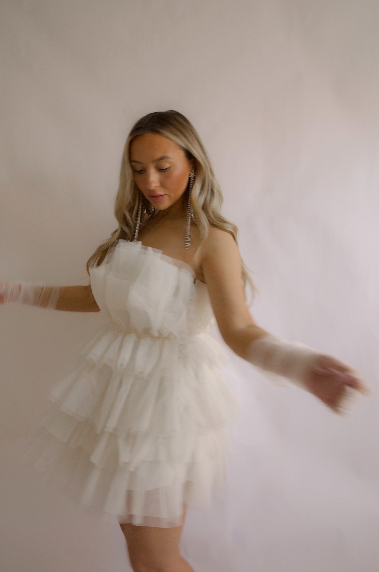 strapless tulle mini dress with a tiered cream organza