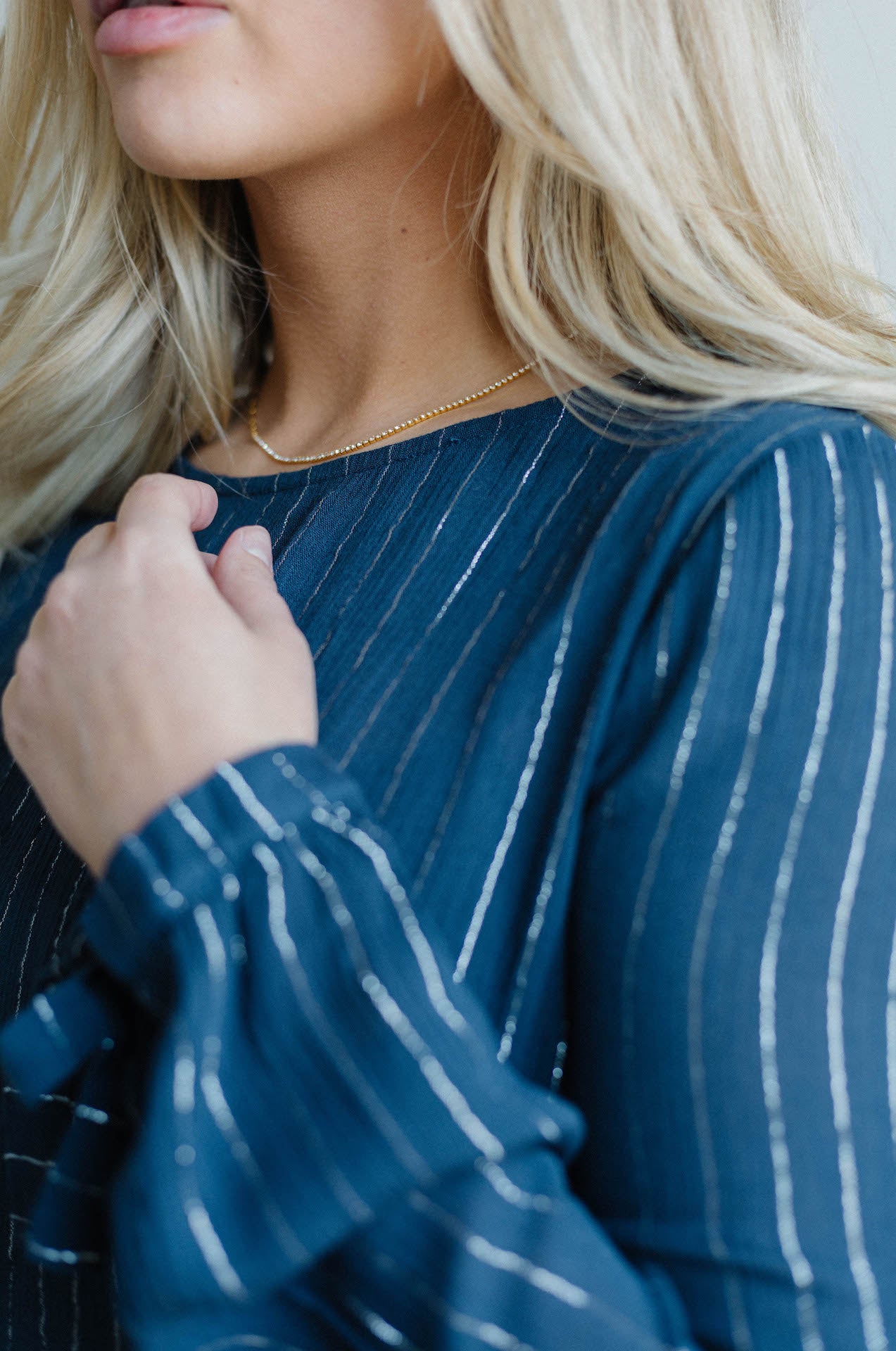 blue mini dress with long sleeves and ruffle hem