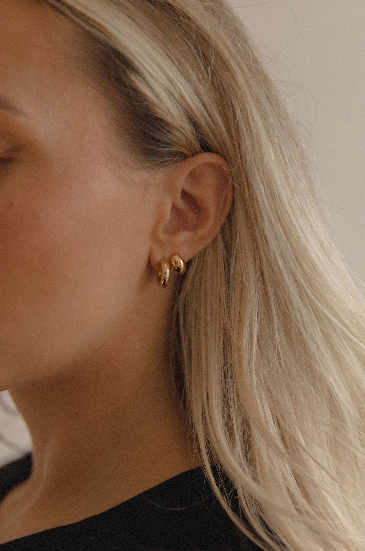 18k gold dome earrings stacked with thick mini hoop earrings