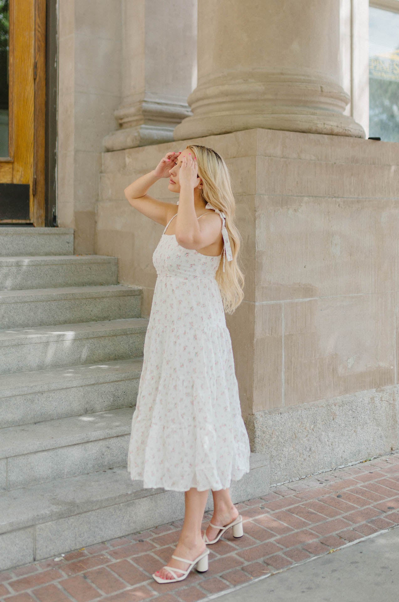 white tiered midi dress with flowers