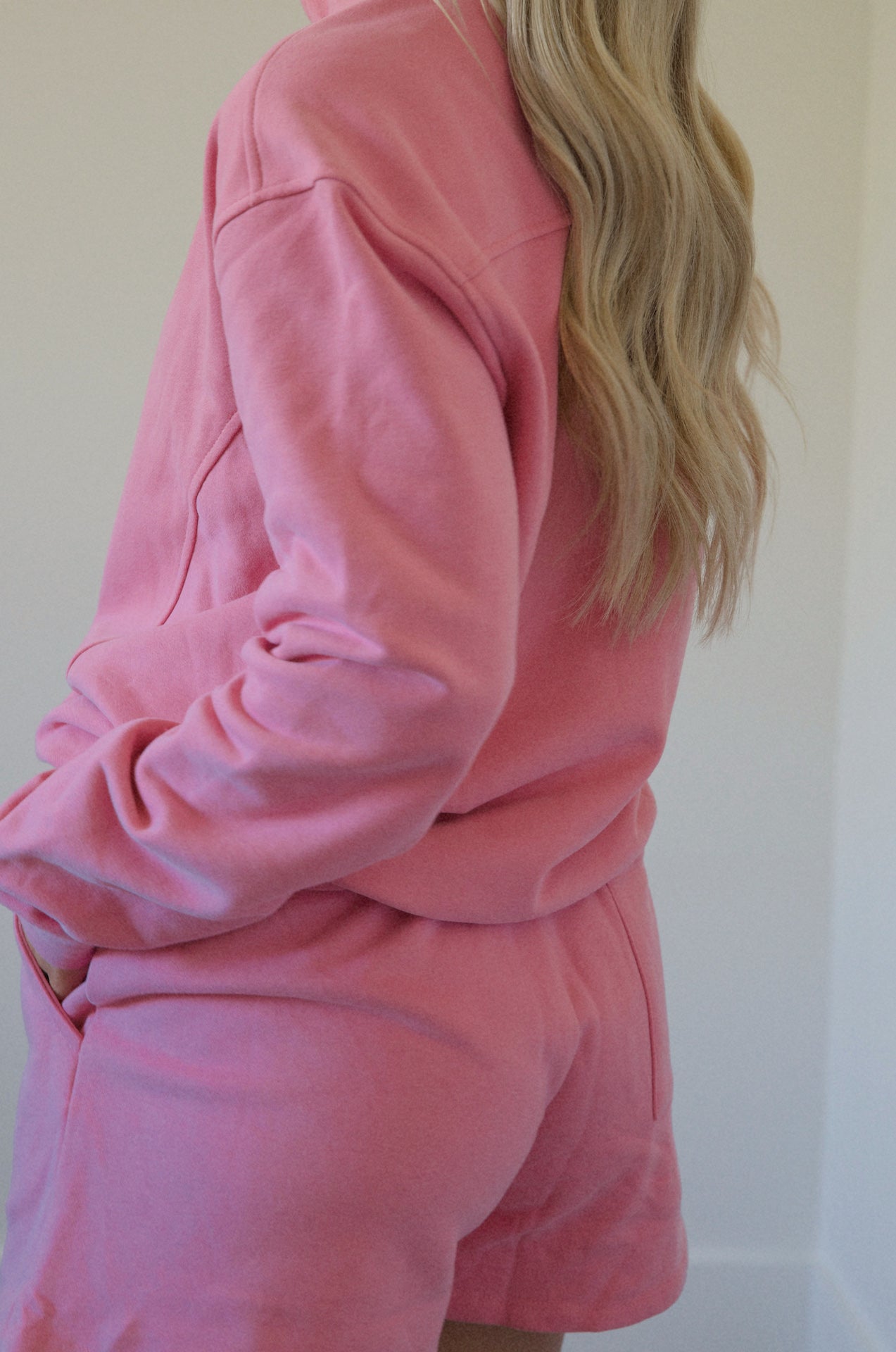 pink fleece sweatshirt and shorts set with a half zip pullover