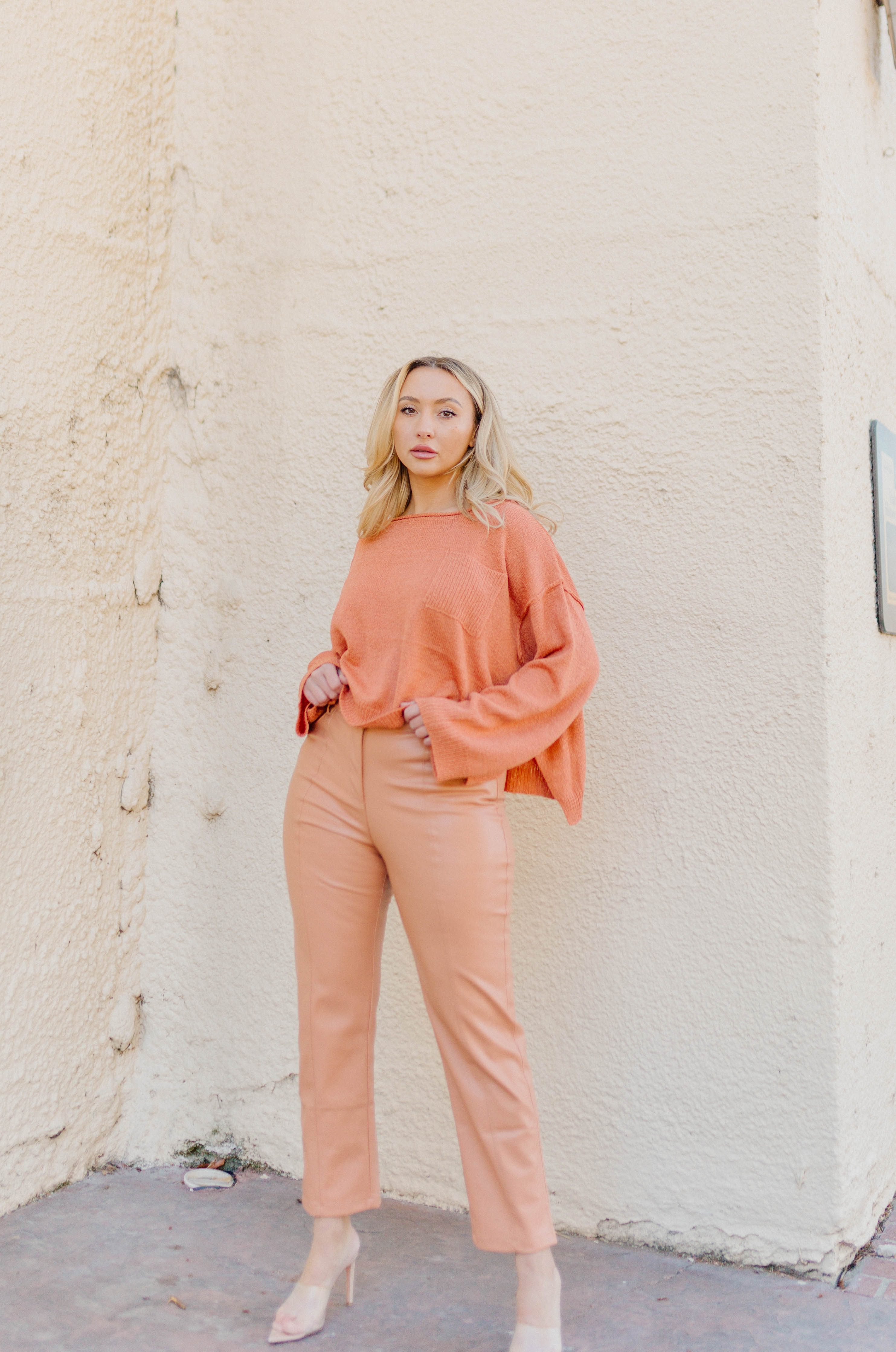 orange high waisted vegan leather pants