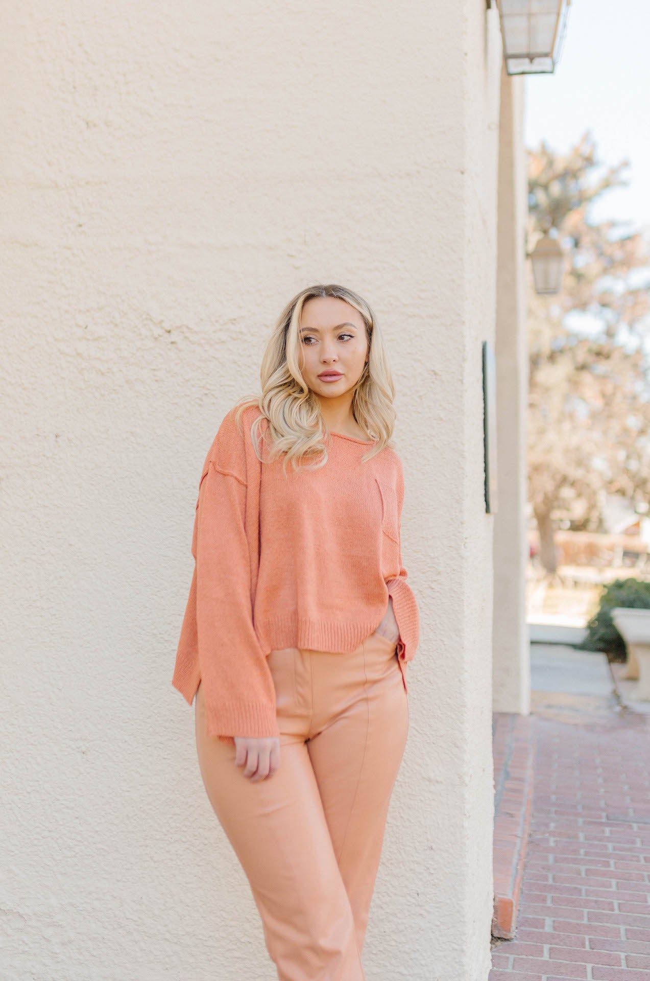 orange high waisted vegan leather pants