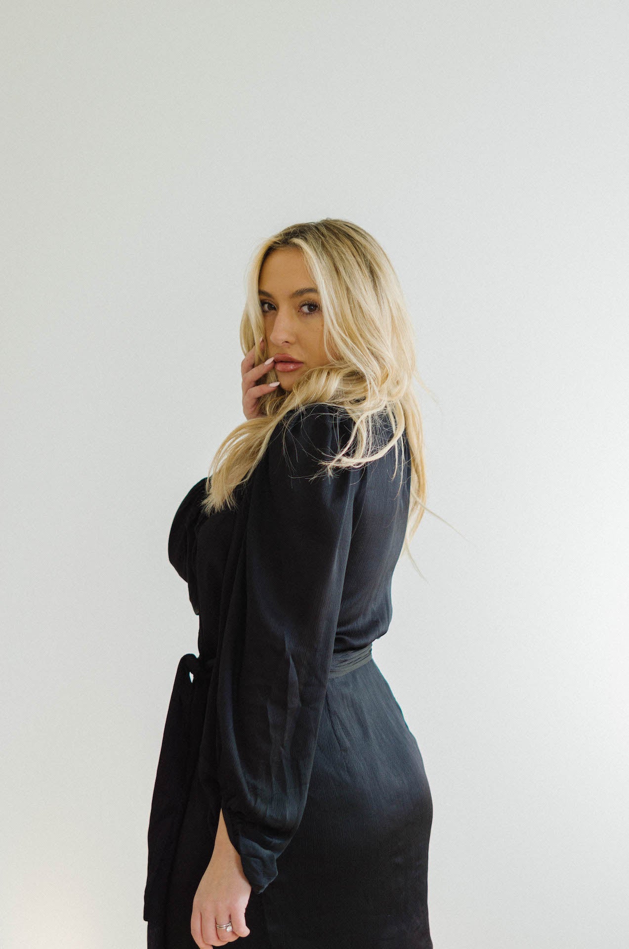 black wrap mini dress with long sleeves