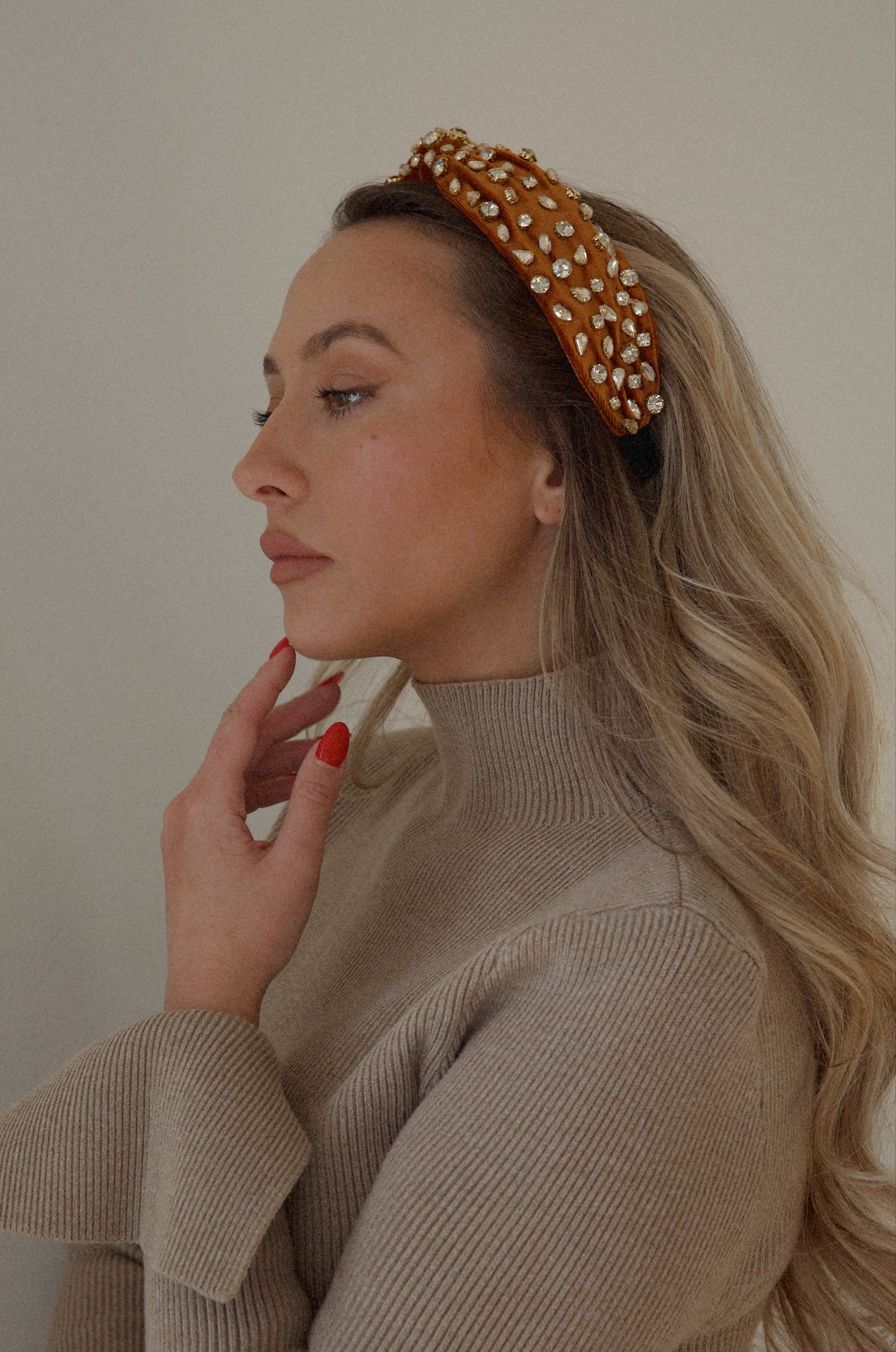 rust rhinestone headband with a top knot design