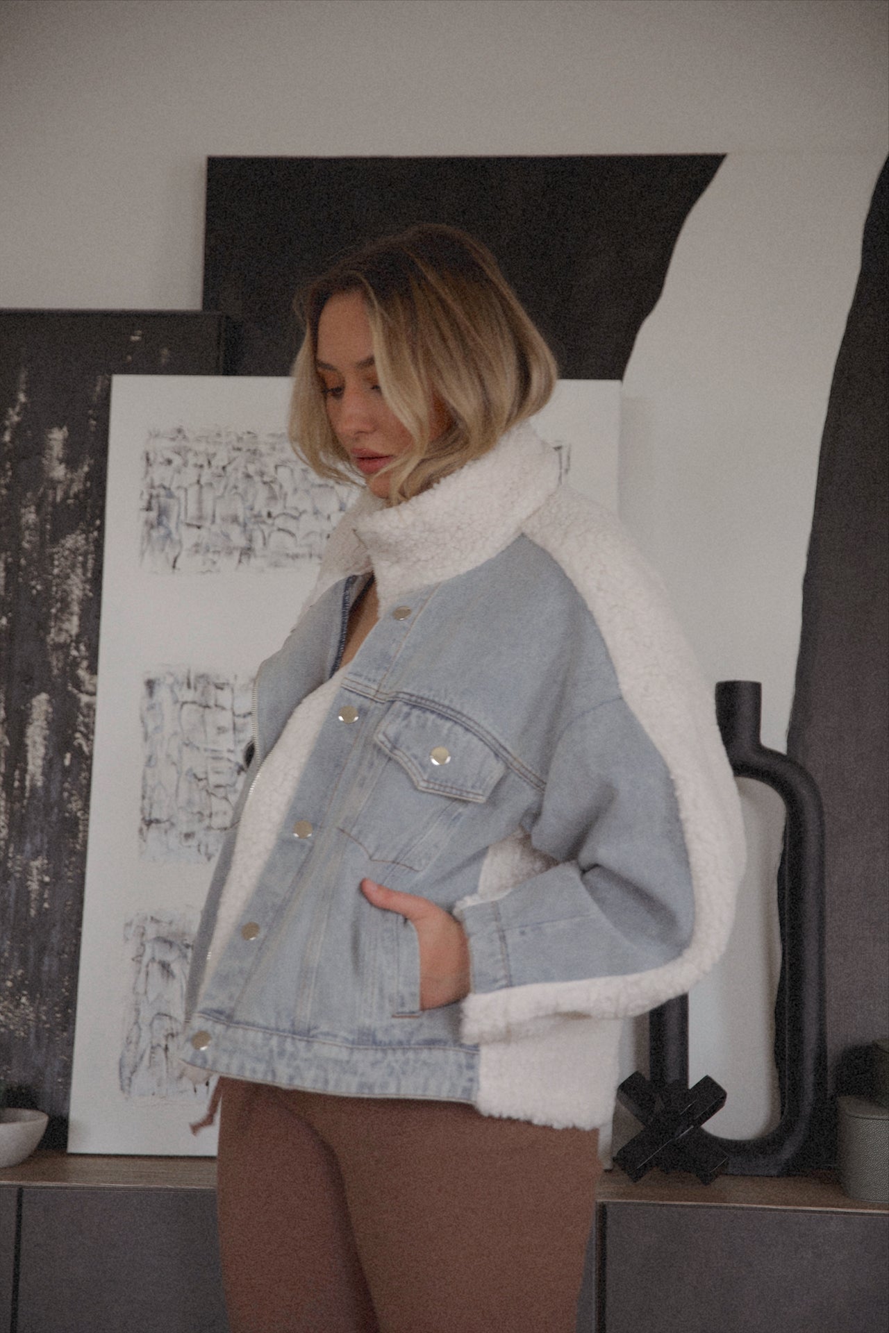 oversized denim jacket with sherpa lining and a zip up denim jacket closure