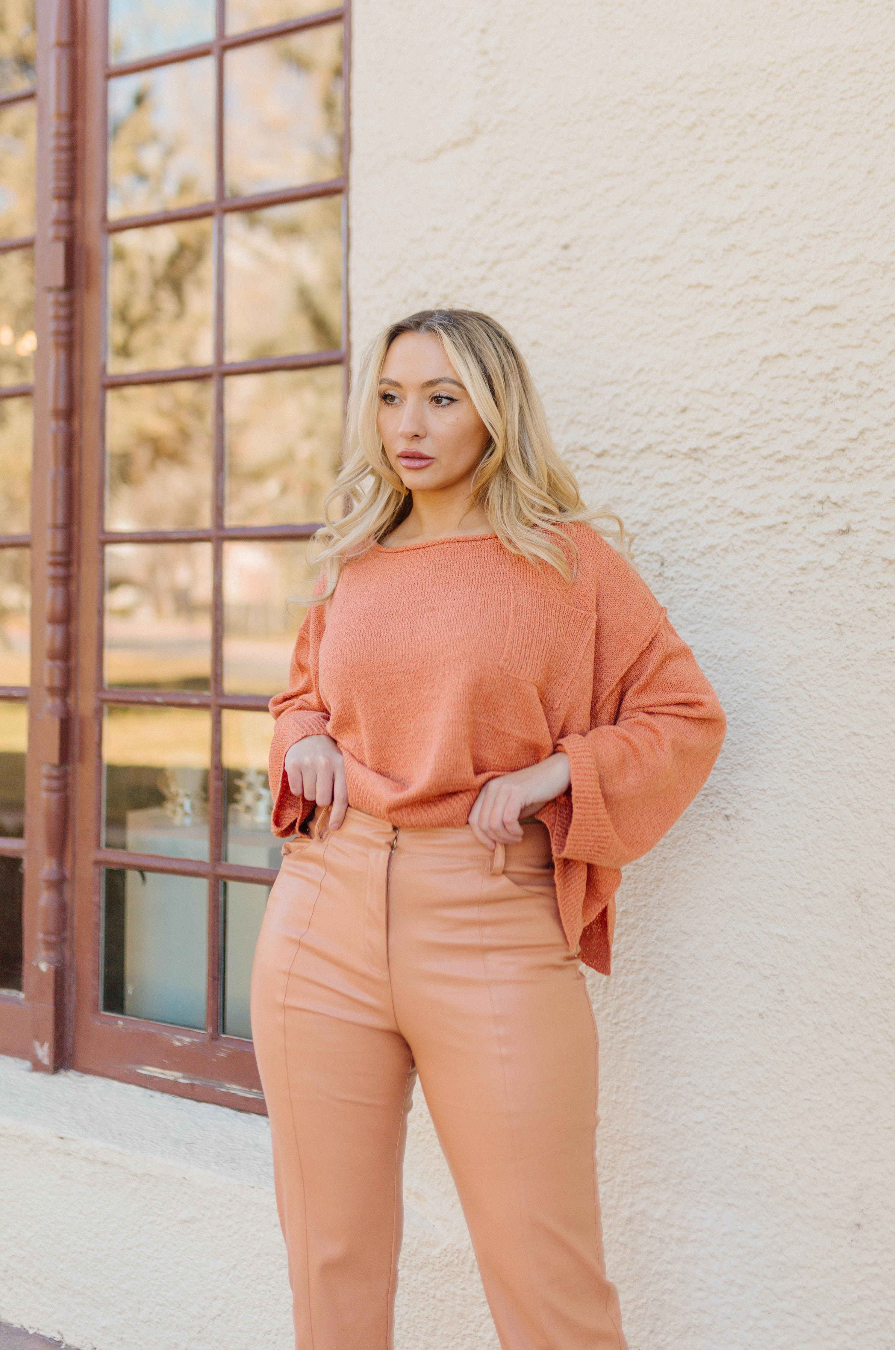 orange high waisted vegan leather pants