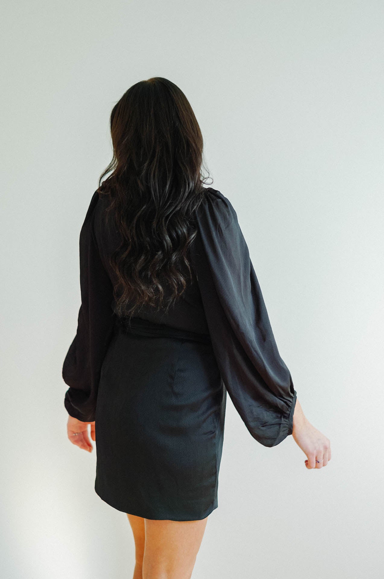 black wrap mini dress with long sleeves