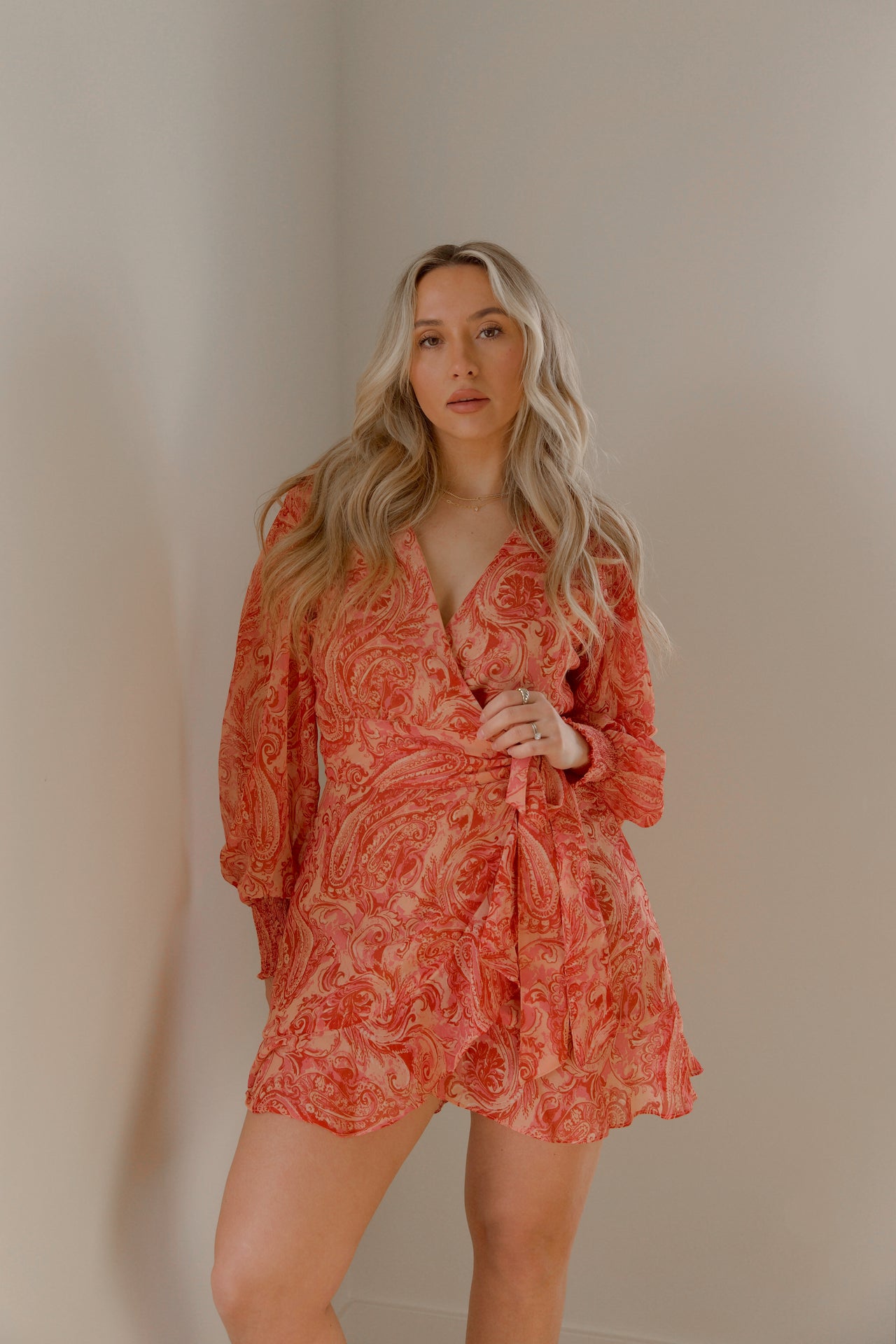 pink and orange paisley print mini wrap dress