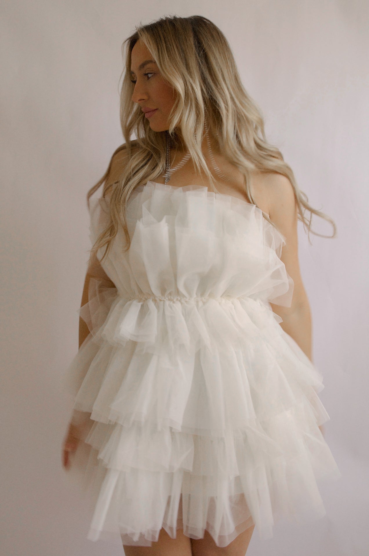 strapless tulle mini dress with a tiered cream organza