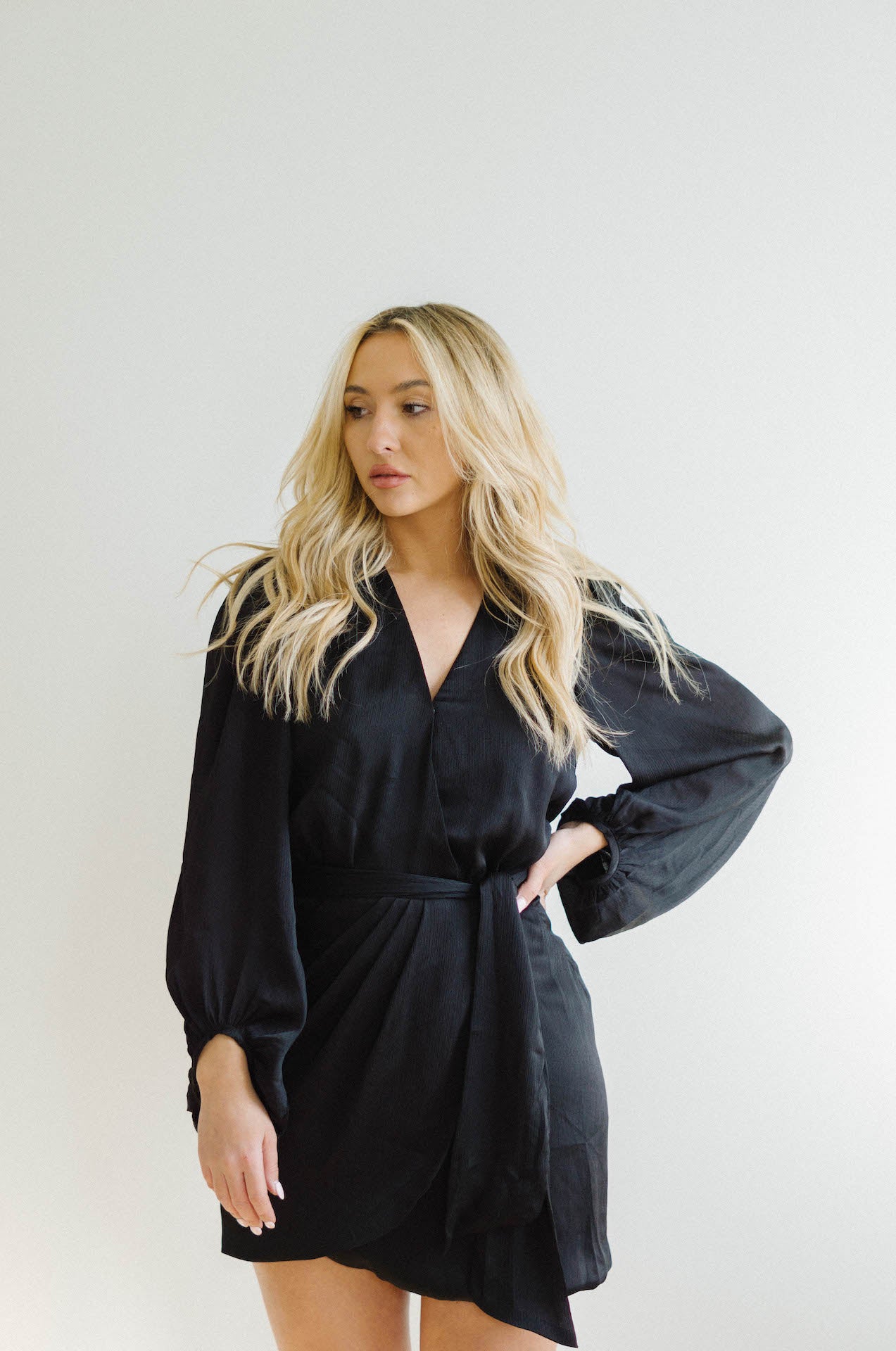 black wrap mini dress with long sleeves