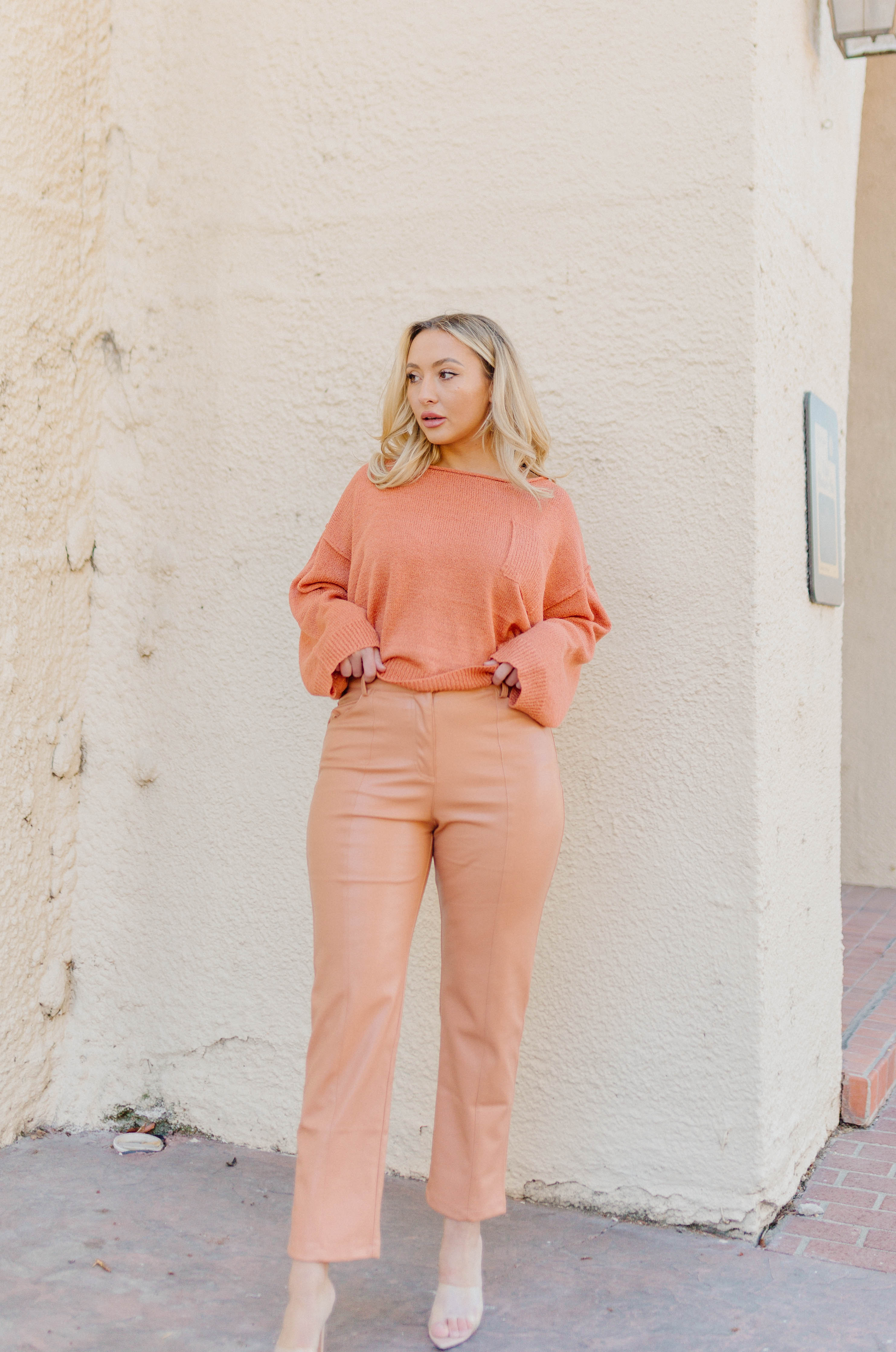 orange high waisted vegan leather pants