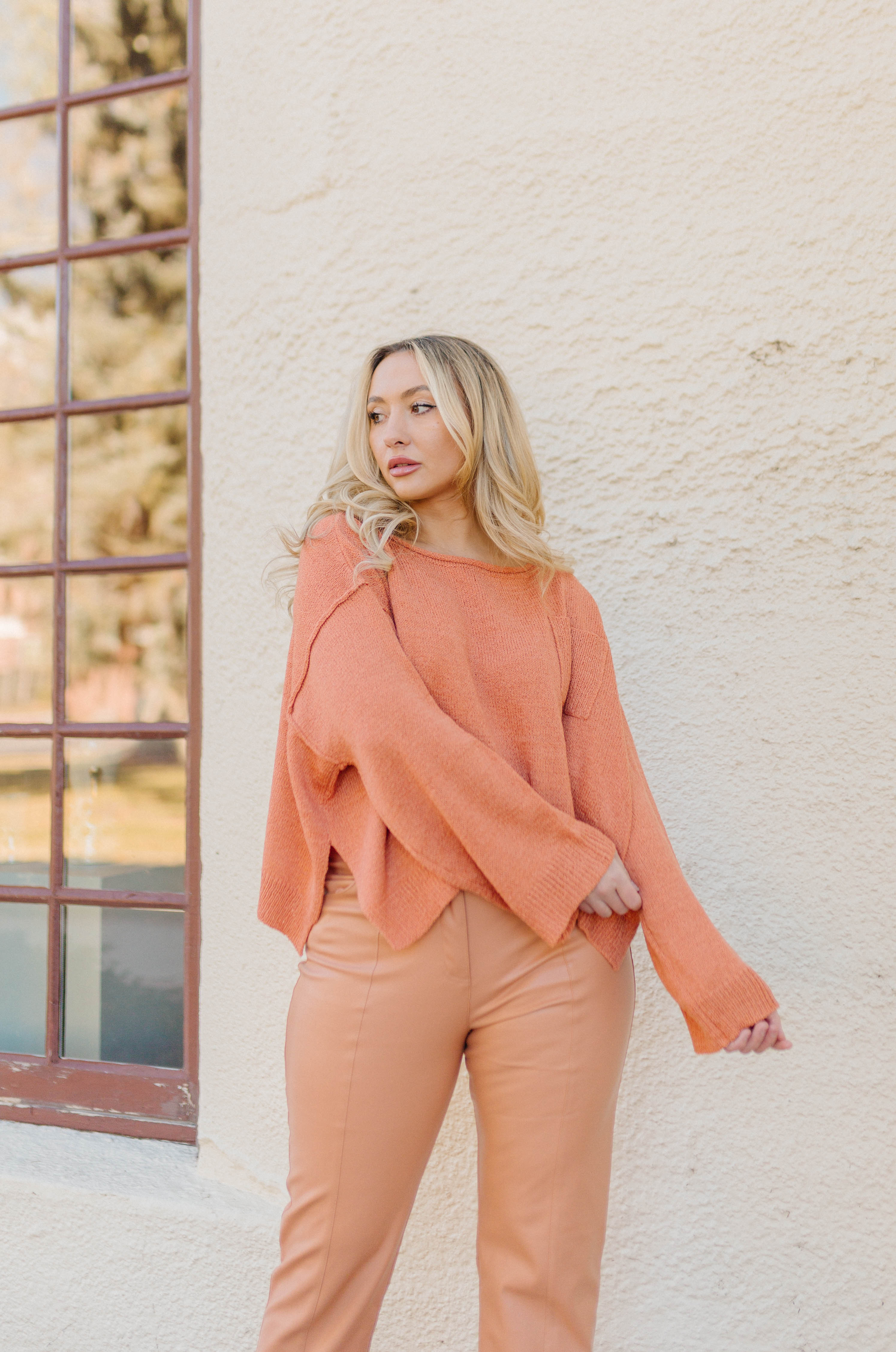 orange high waisted vegan leather pants