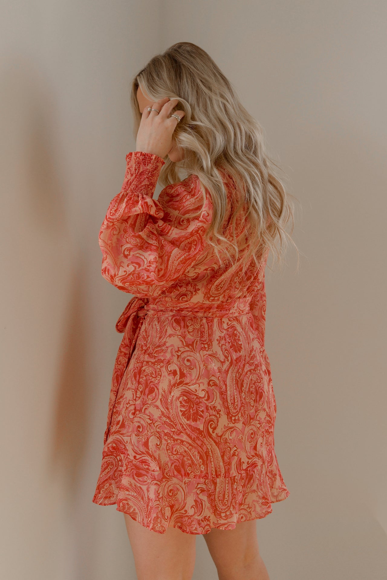 pink and orange paisley print mini wrap dress