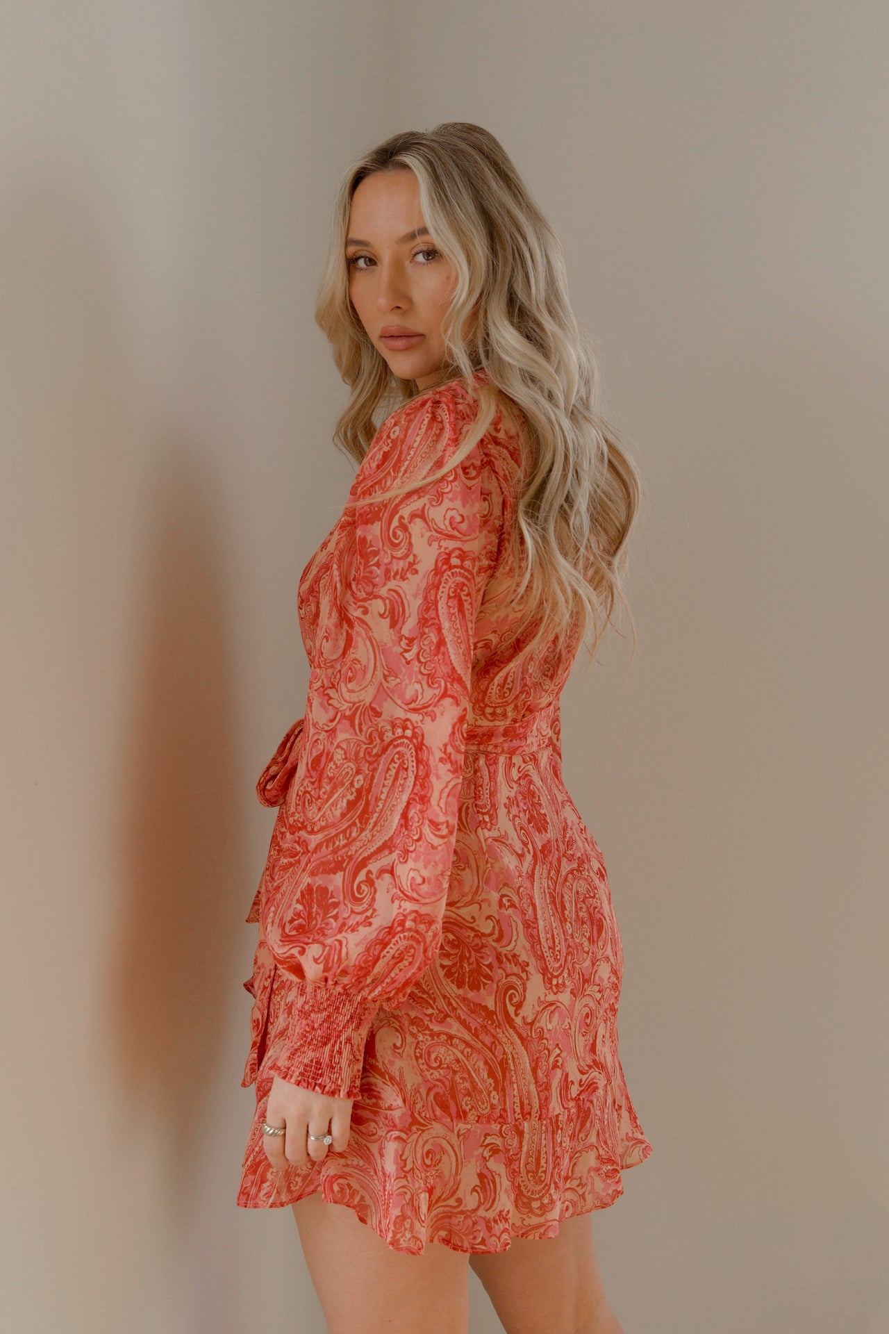 pink and orange paisley print mini wrap dress