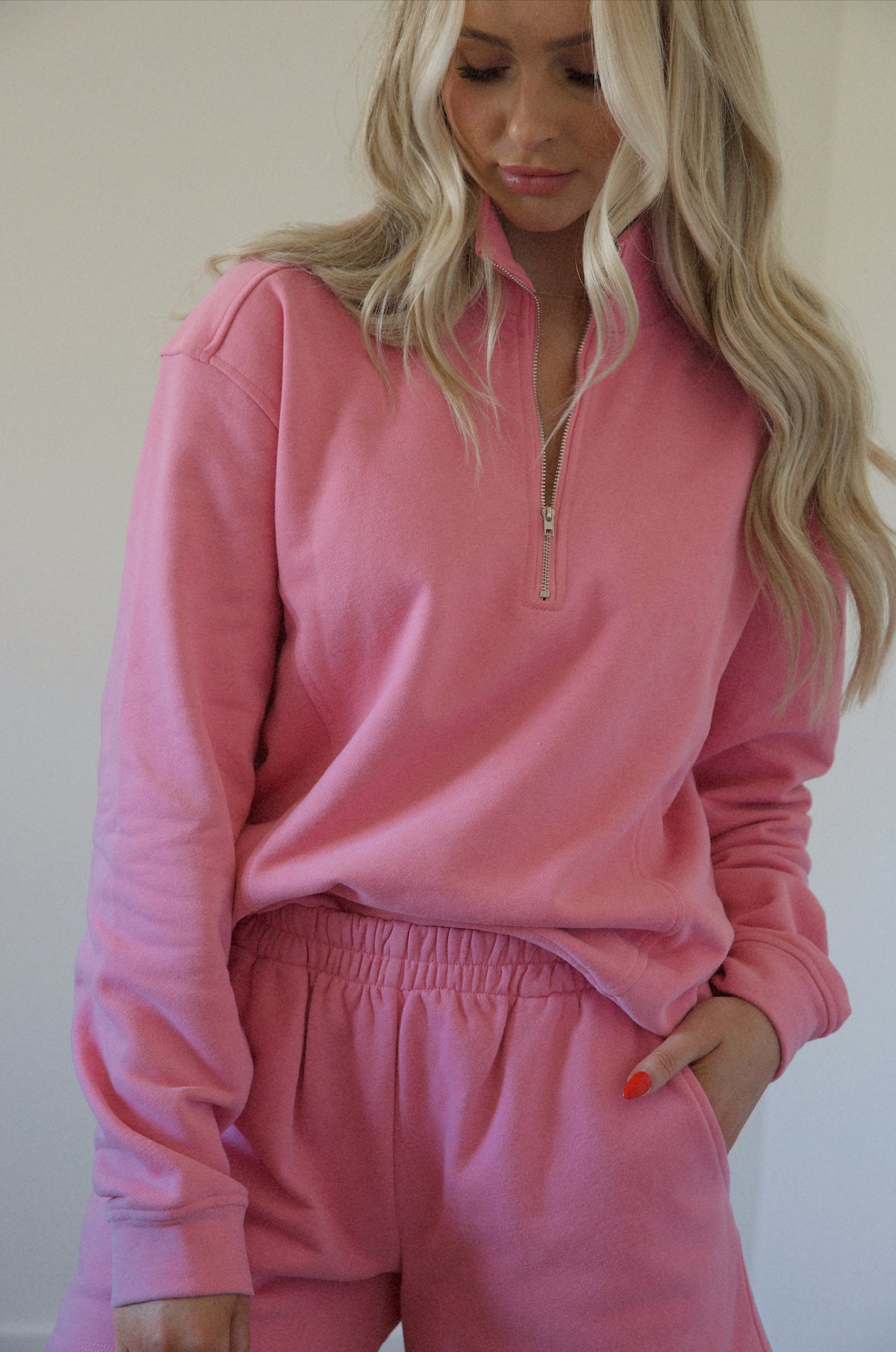 pink fleece sweatshirt and shorts set with a half zip pullover