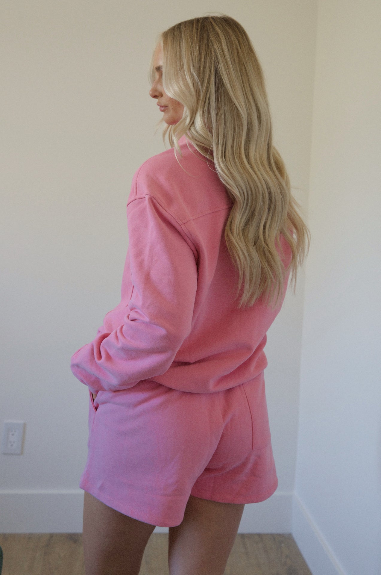pink fleece sweatshirt and shorts set with a half zip pullover