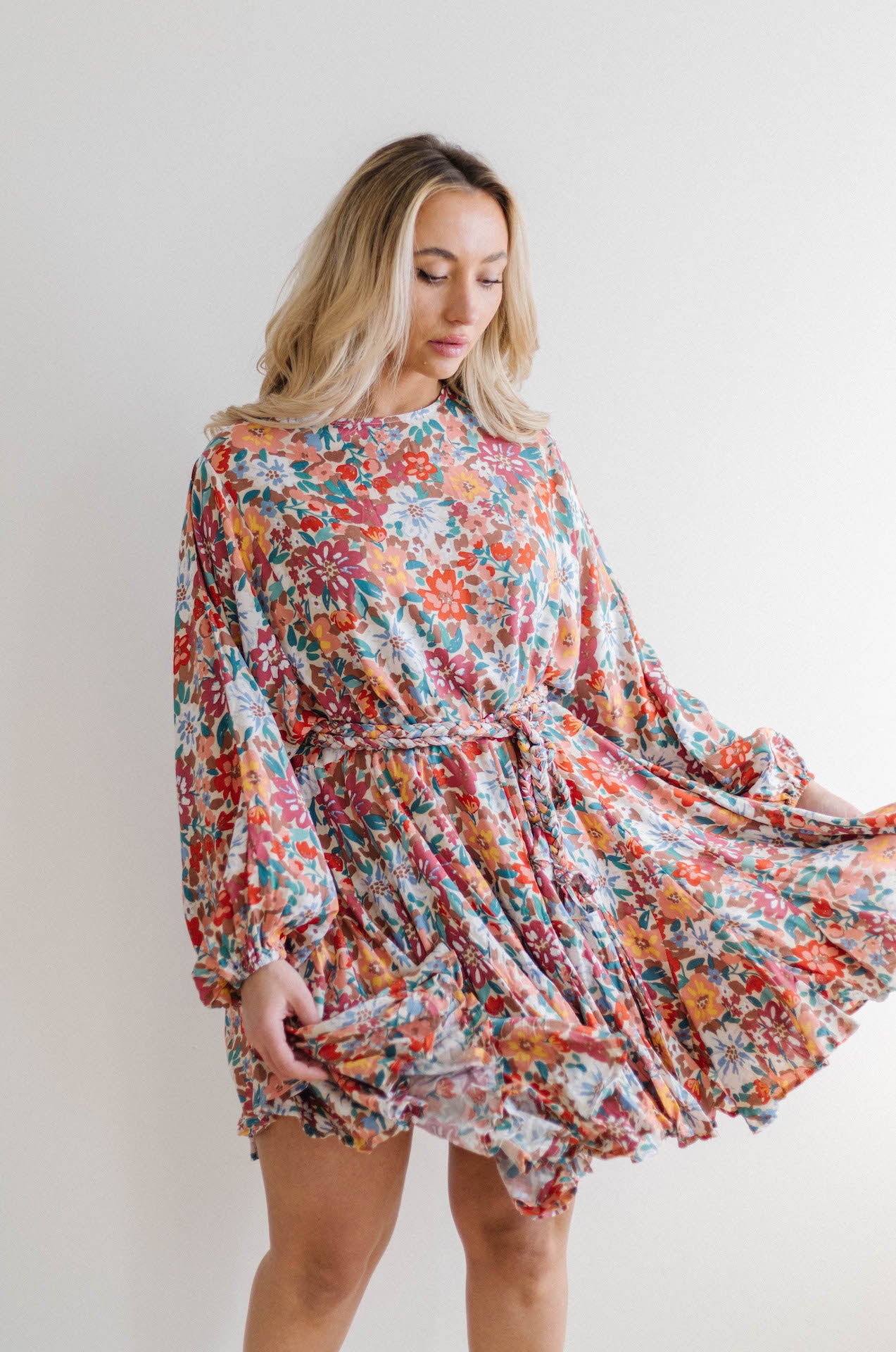 multicolor floral print dress with long sleeves and braided belt