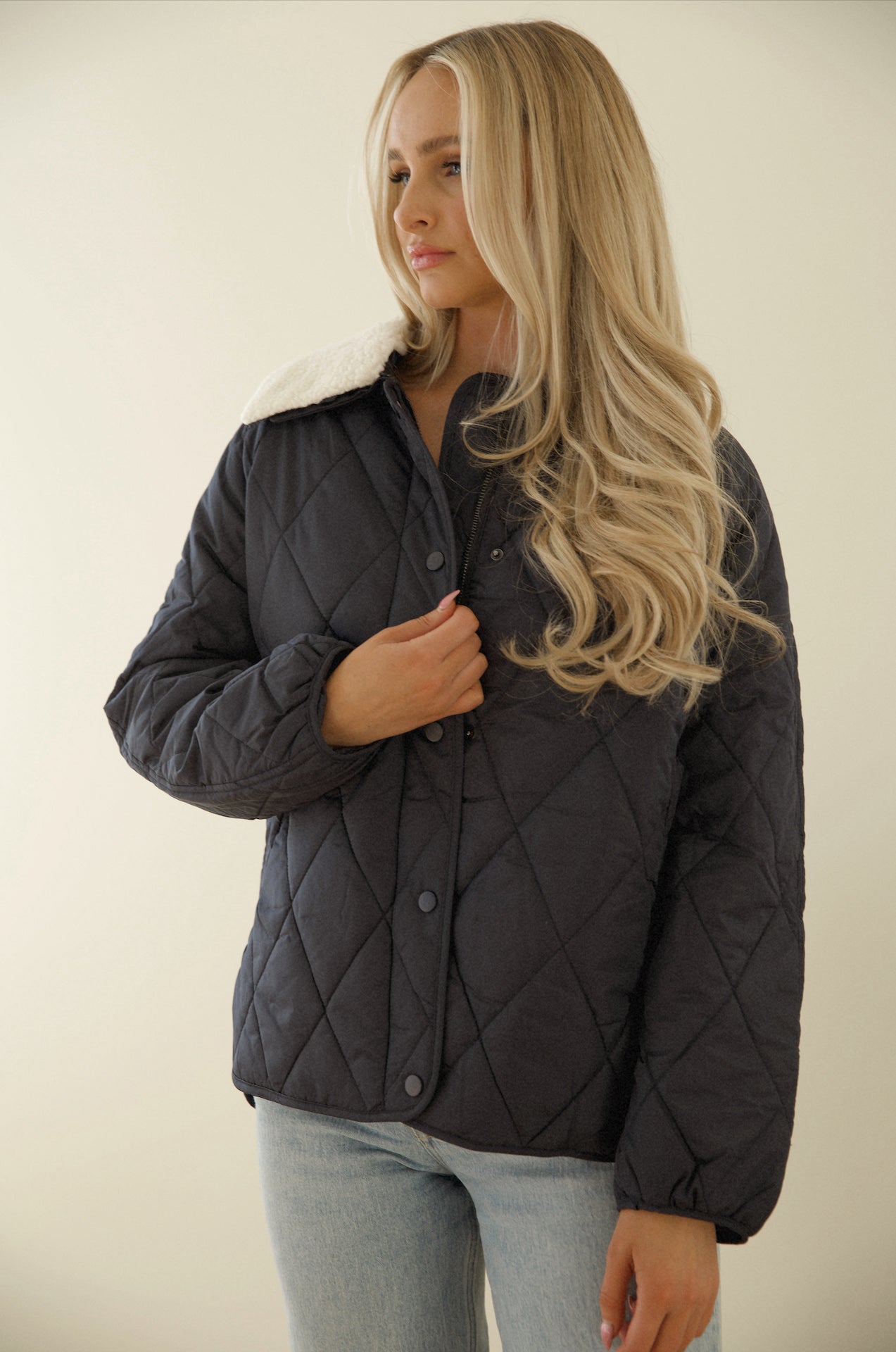 blue quilted puffer jacket with a sherpa collar
