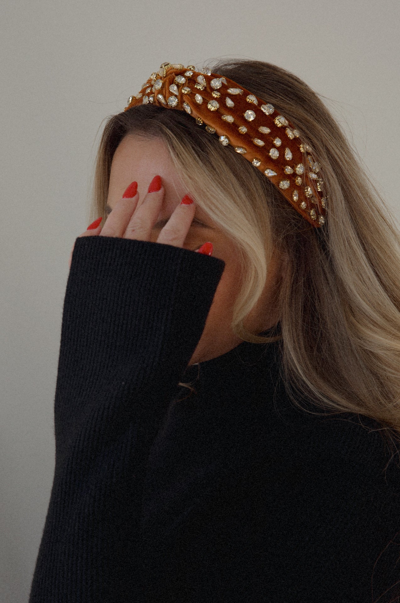 rust rhinestone headband with a top knot design