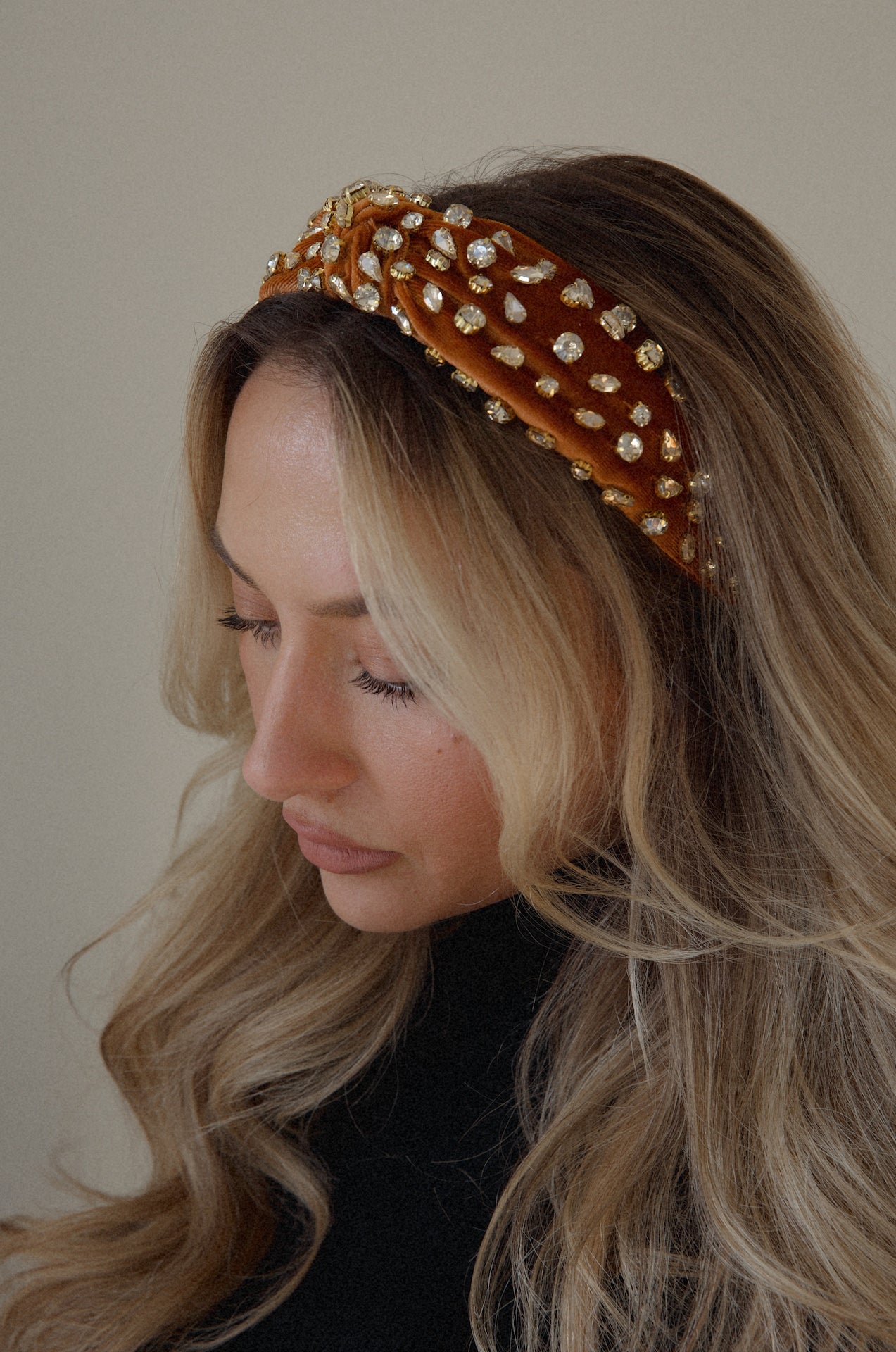 rust rhinestone headband with a top knot design