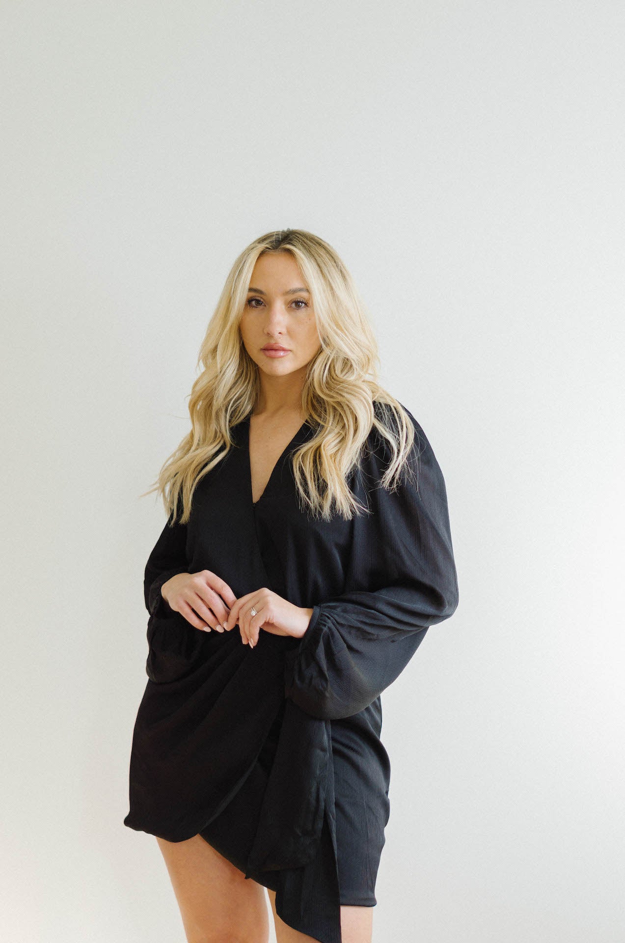 black wrap mini dress with long sleeves