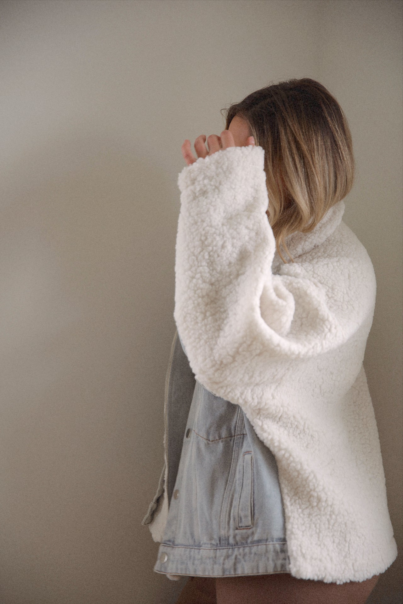 oversized denim jacket with sherpa lining and a zip up denim jacket closure