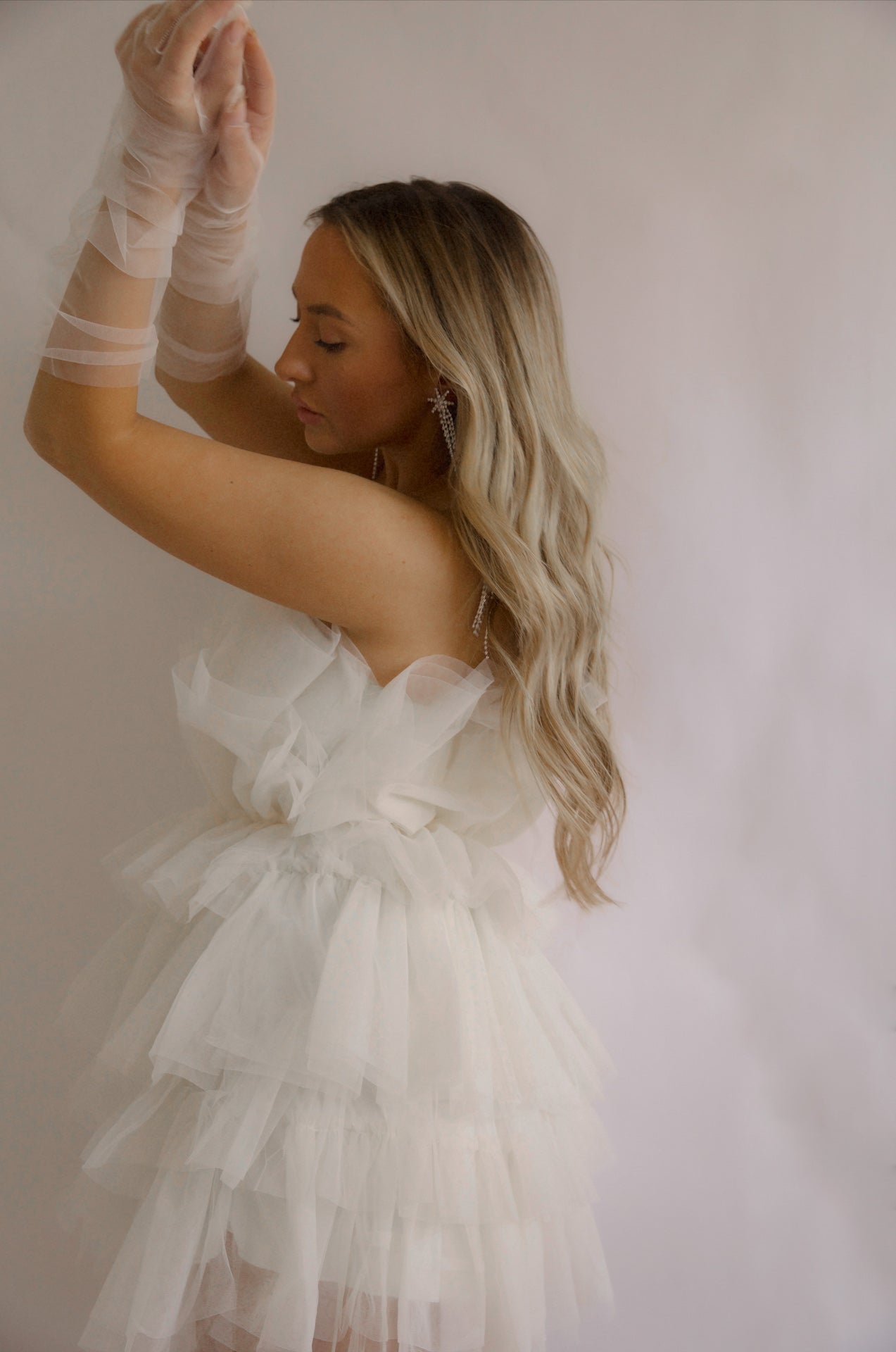 strapless tulle mini dress with a tiered cream organza