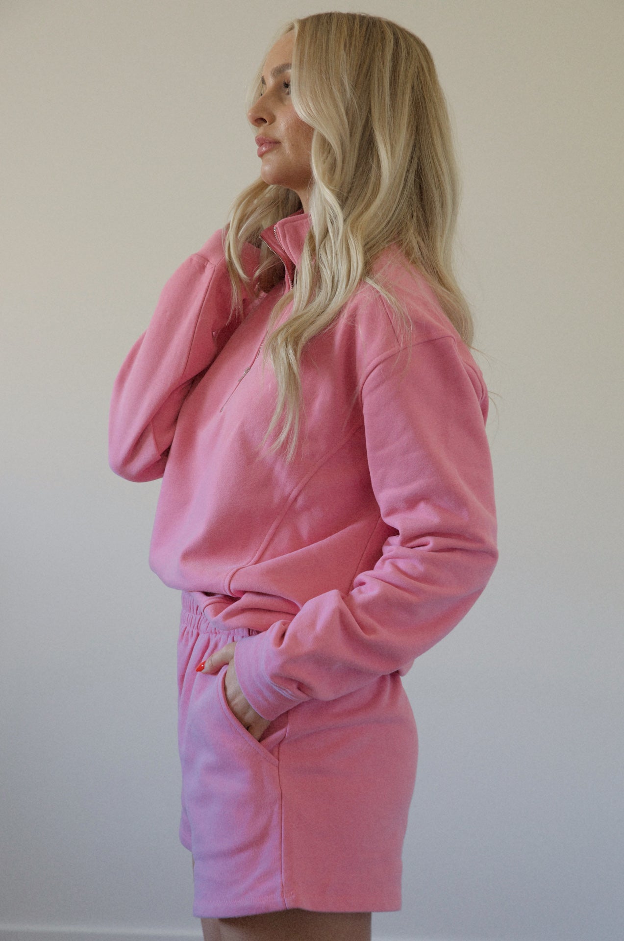 pink fleece sweatshirt and shorts set with a half zip pullover