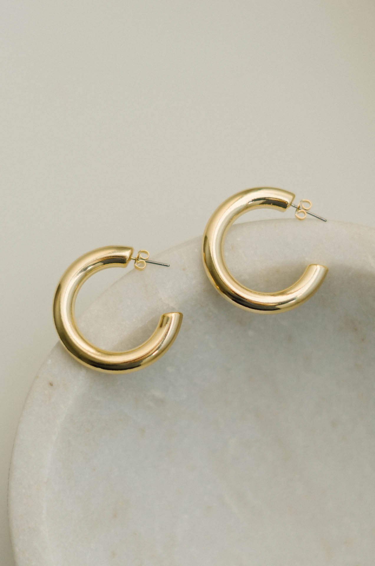 thick hollow hoop 14 karat gold earrings