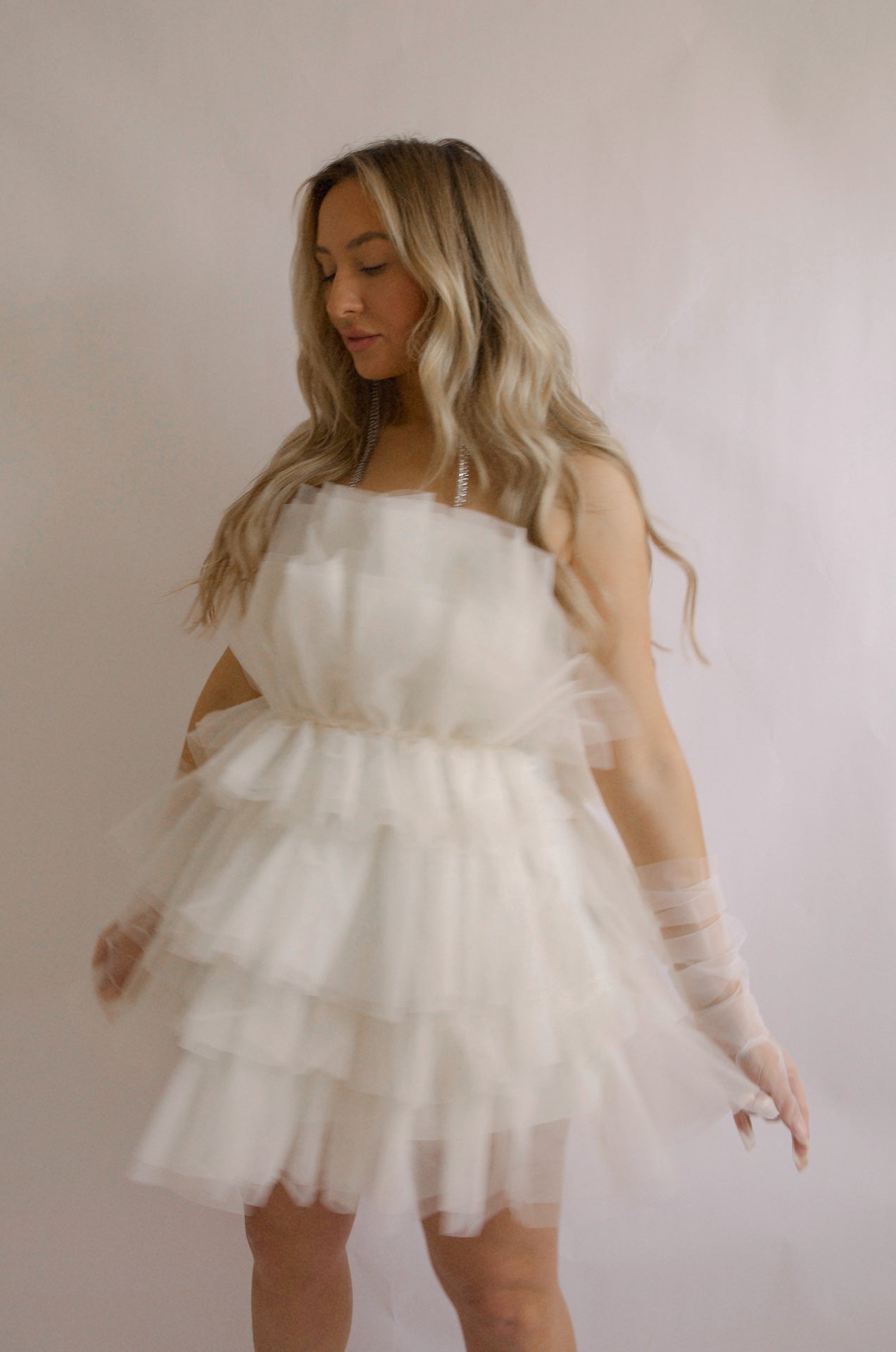 strapless tulle mini dress with a tiered cream organza