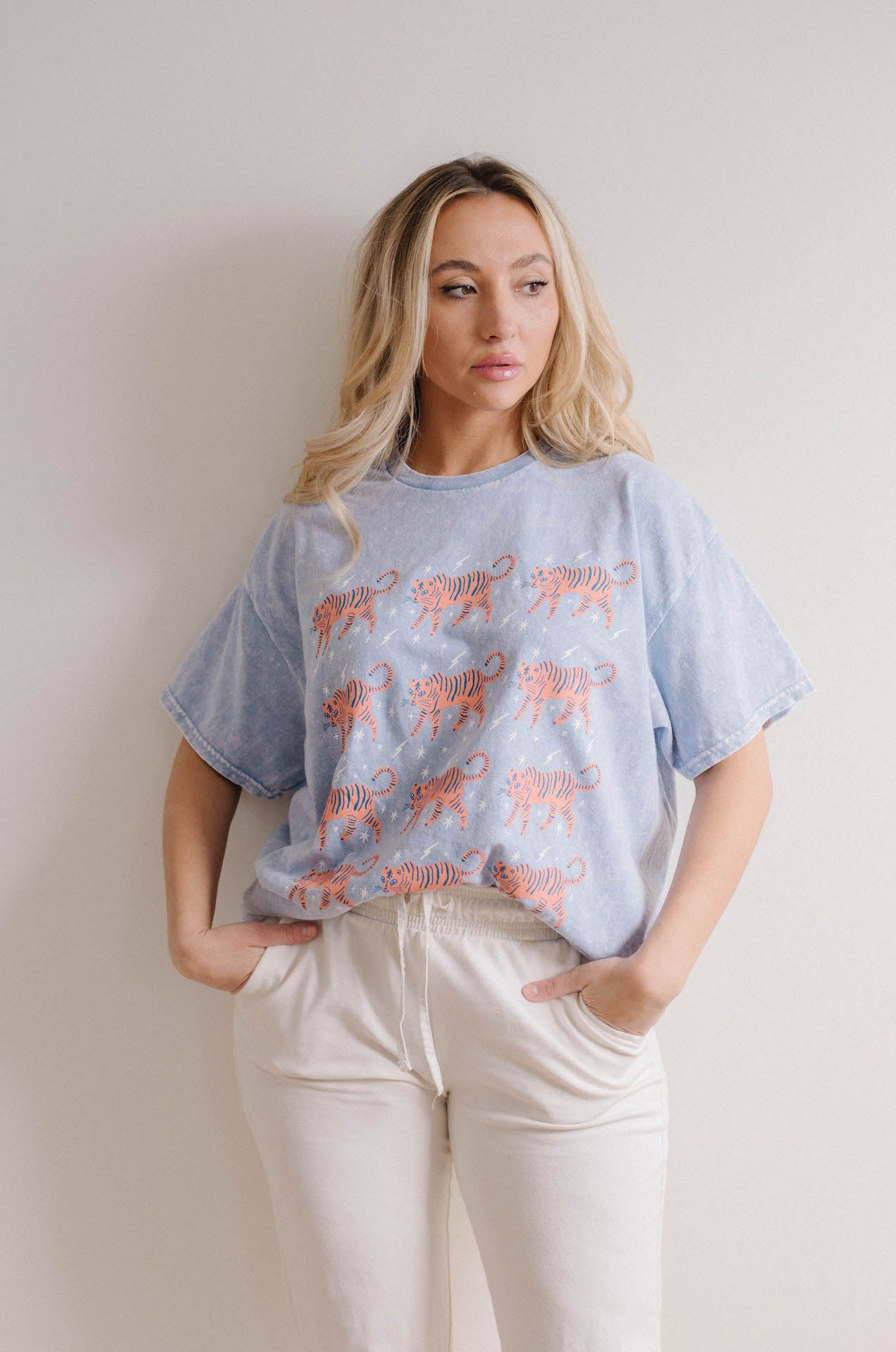 orange tigers on a blue mineral wash oversized tee