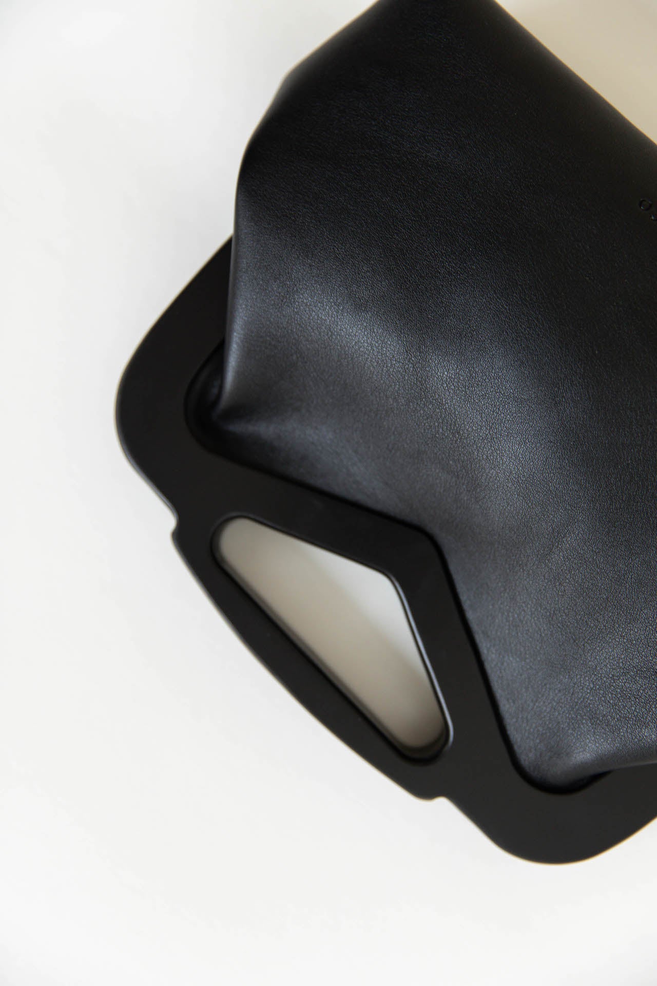 black vegan leather triangle top handle bag