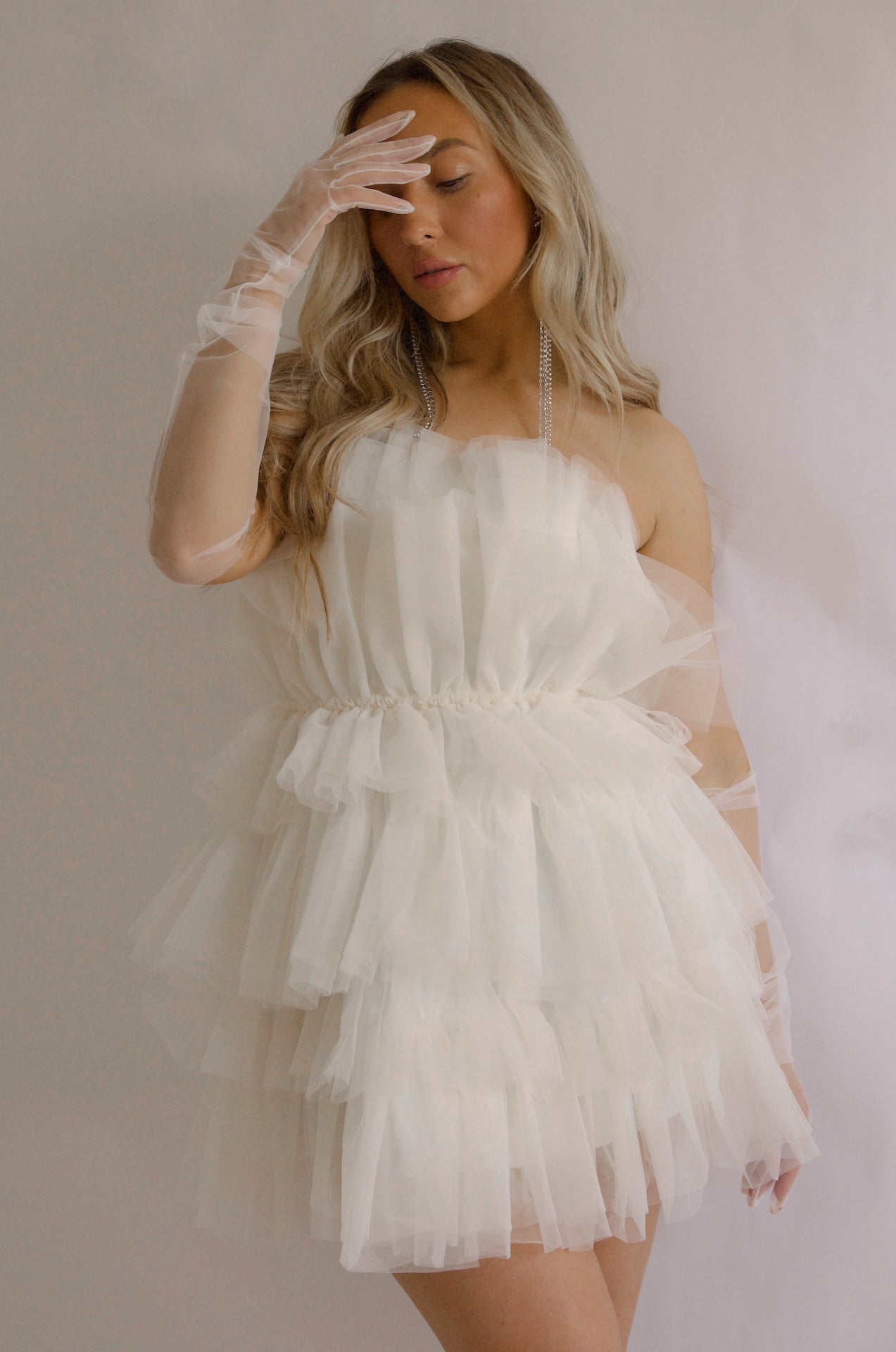 strapless tulle mini dress with a tiered cream organza