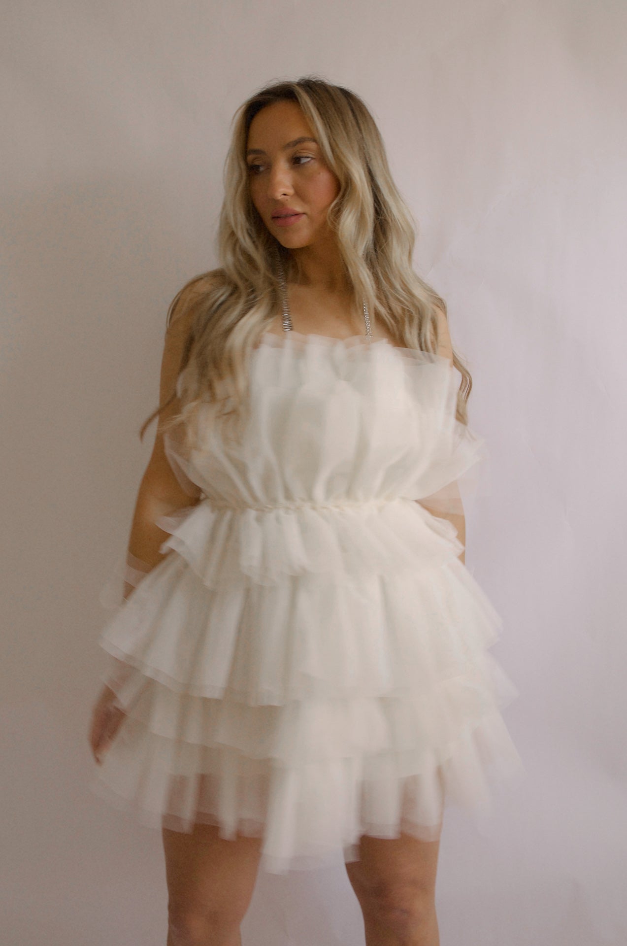 strapless tulle mini dress with a tiered cream organza