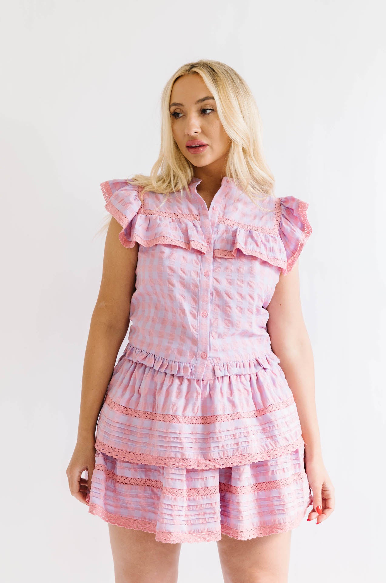 pink and purple button down top and ruffle mini skirt two piece set