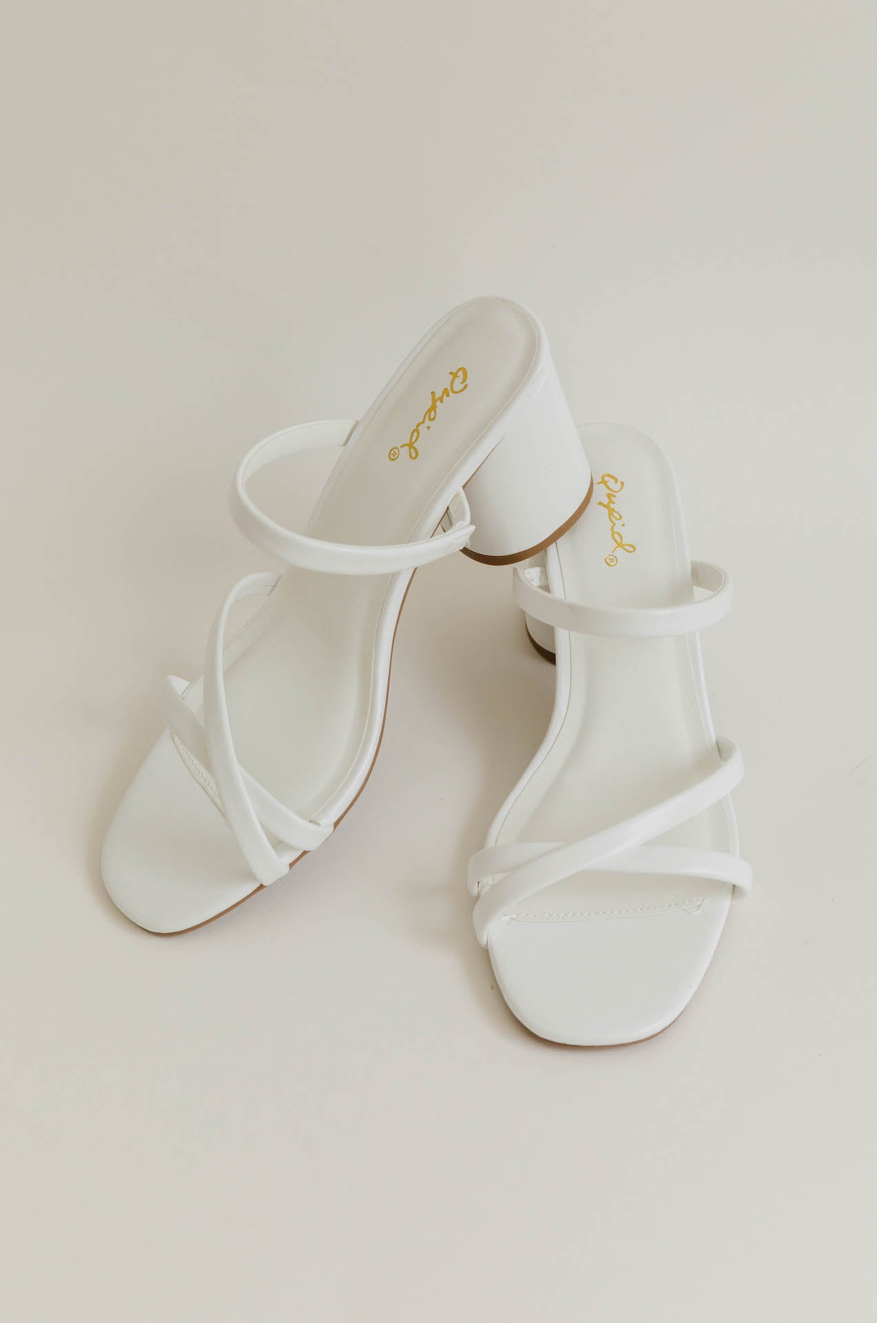 white strappy heel sandals with a low chunky block heel