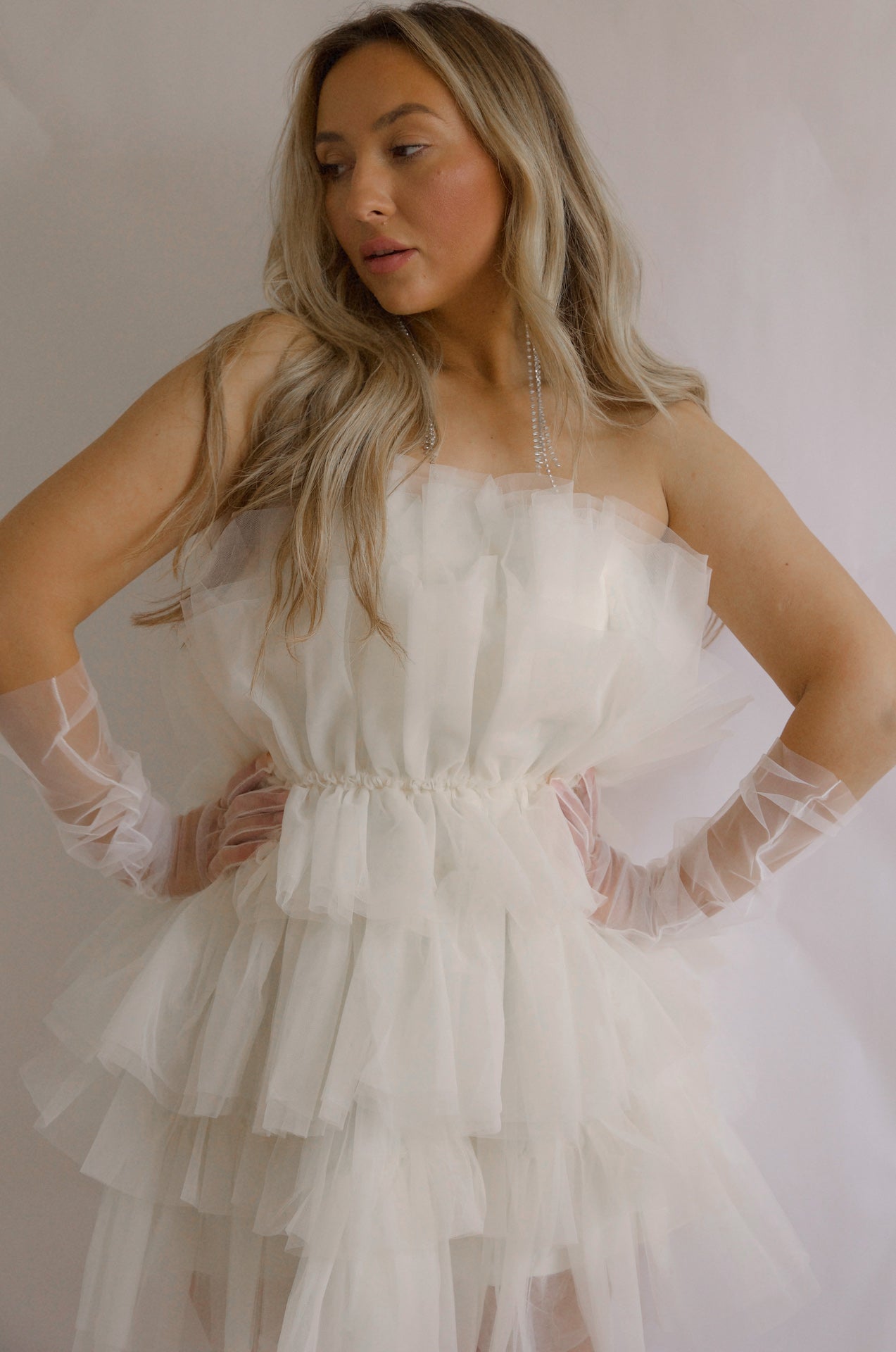strapless tulle mini dress with a tiered cream organza