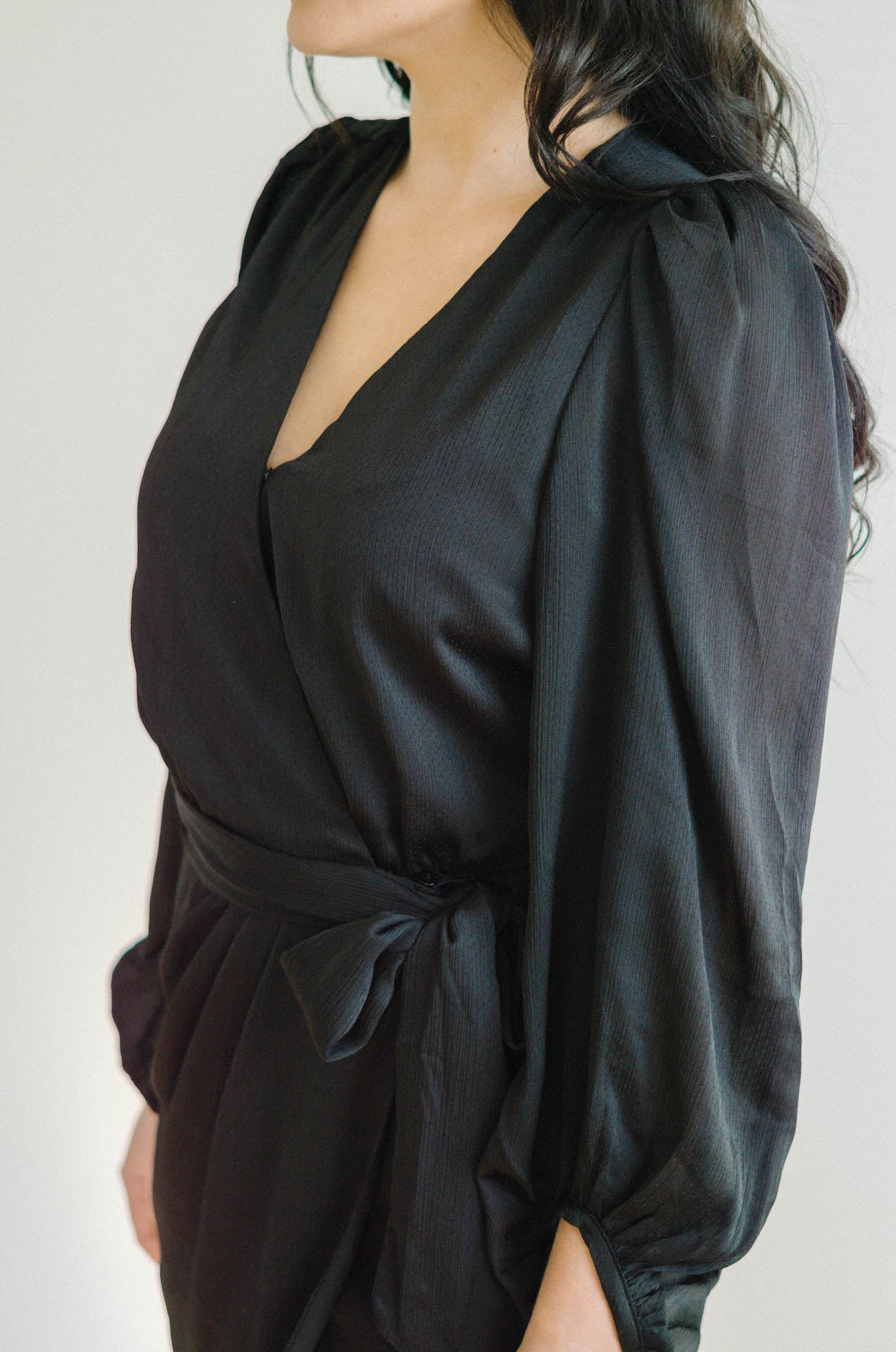 black wrap mini dress with long sleeves