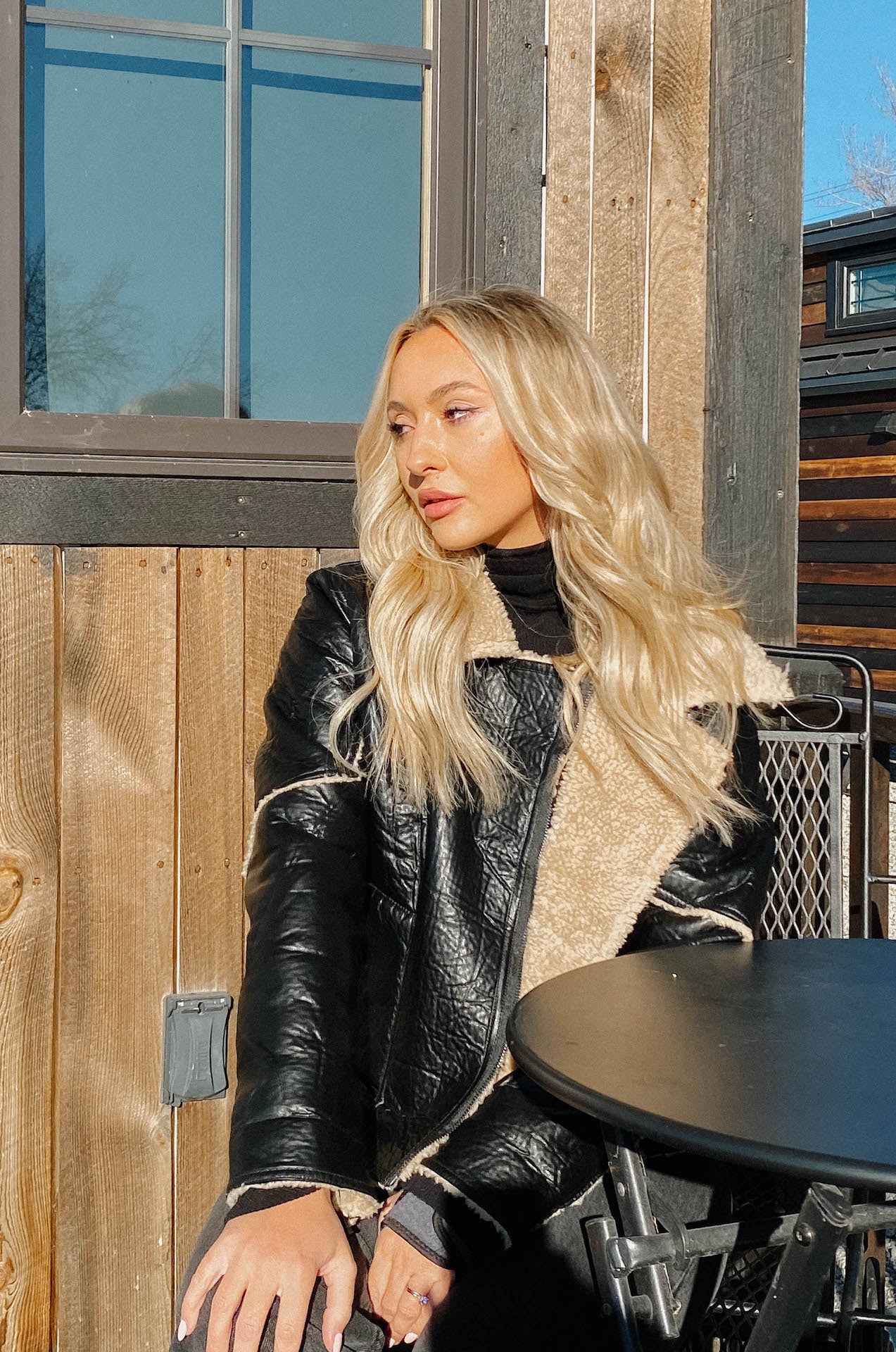 womens black faux leather biker jacket with shearling trim and interior