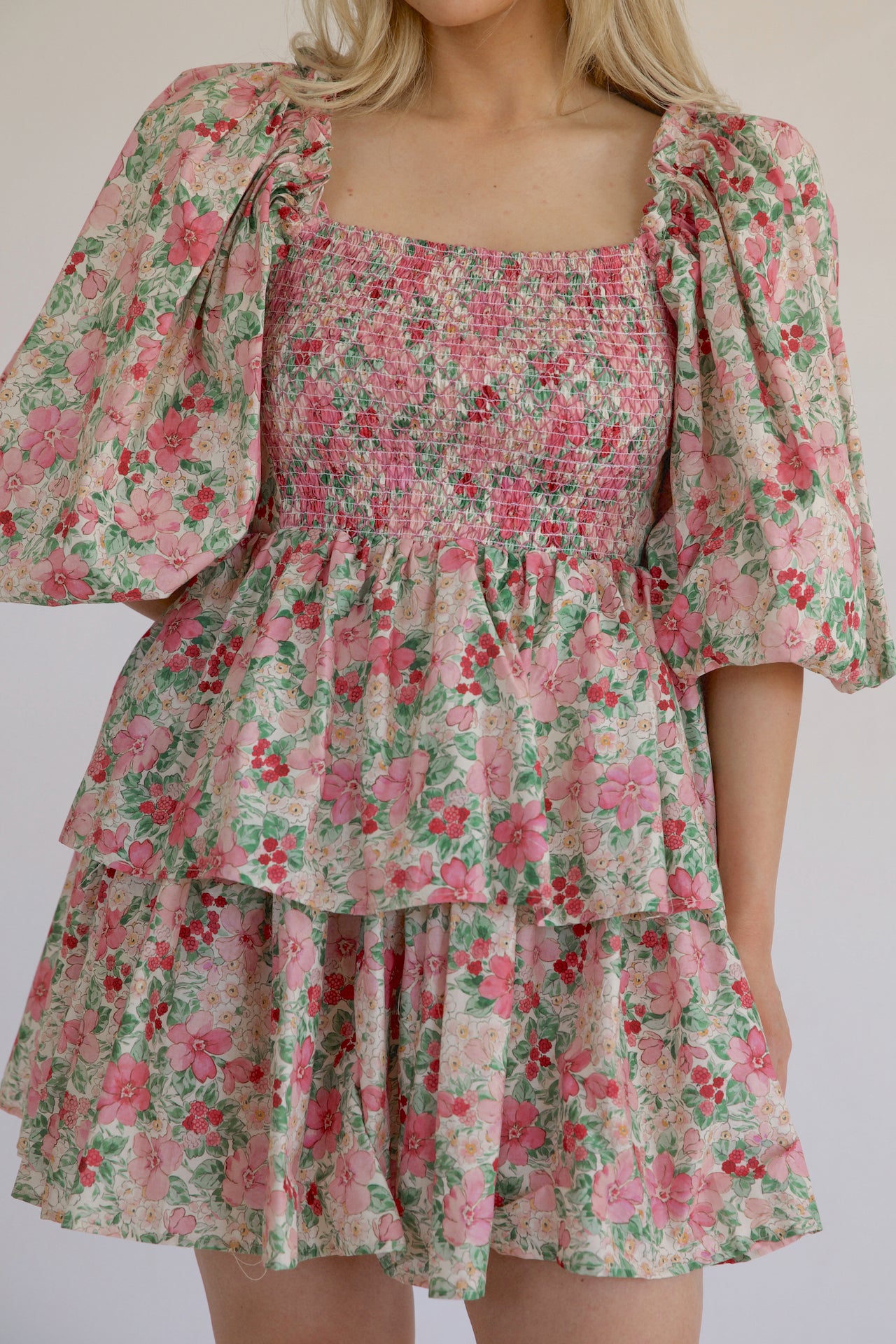 pink and green floral puff sleeve tiered mini dress that is a statement dress