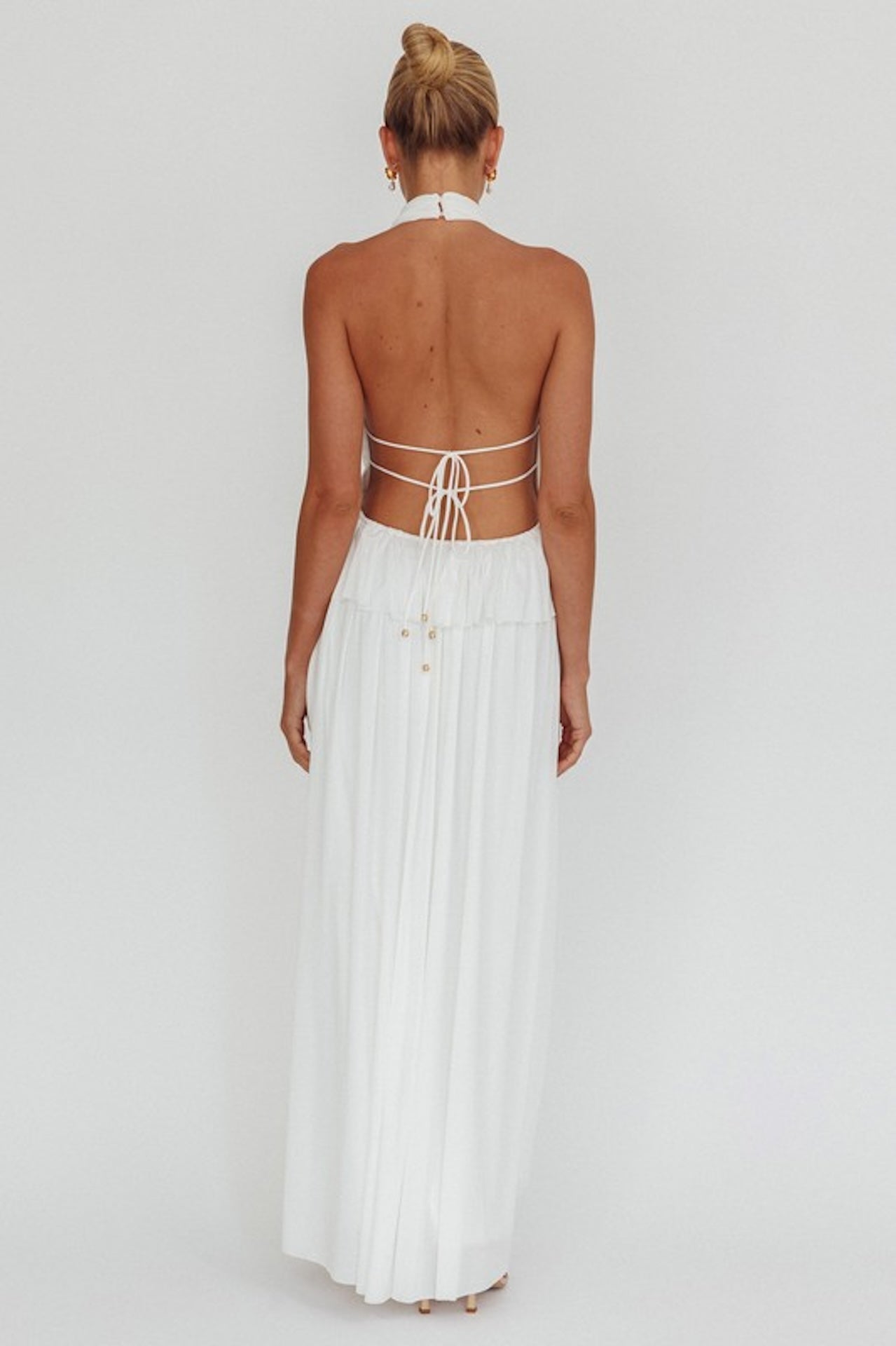 white halter maxi dress with peplum waist and open back