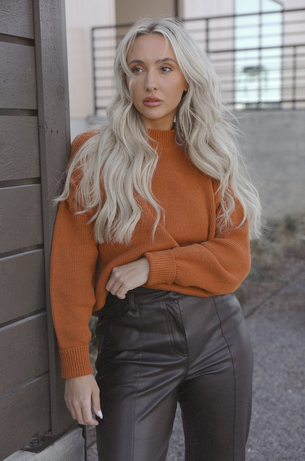 burnt orange camel knit sweater with an oversized fit