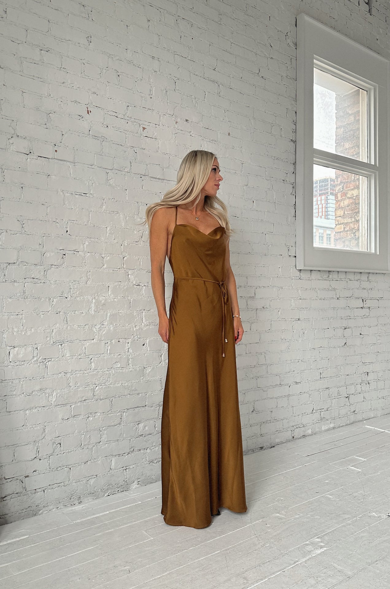 sleeveless bronze brown satin maxi dress with a cowl neckline and criss cross back